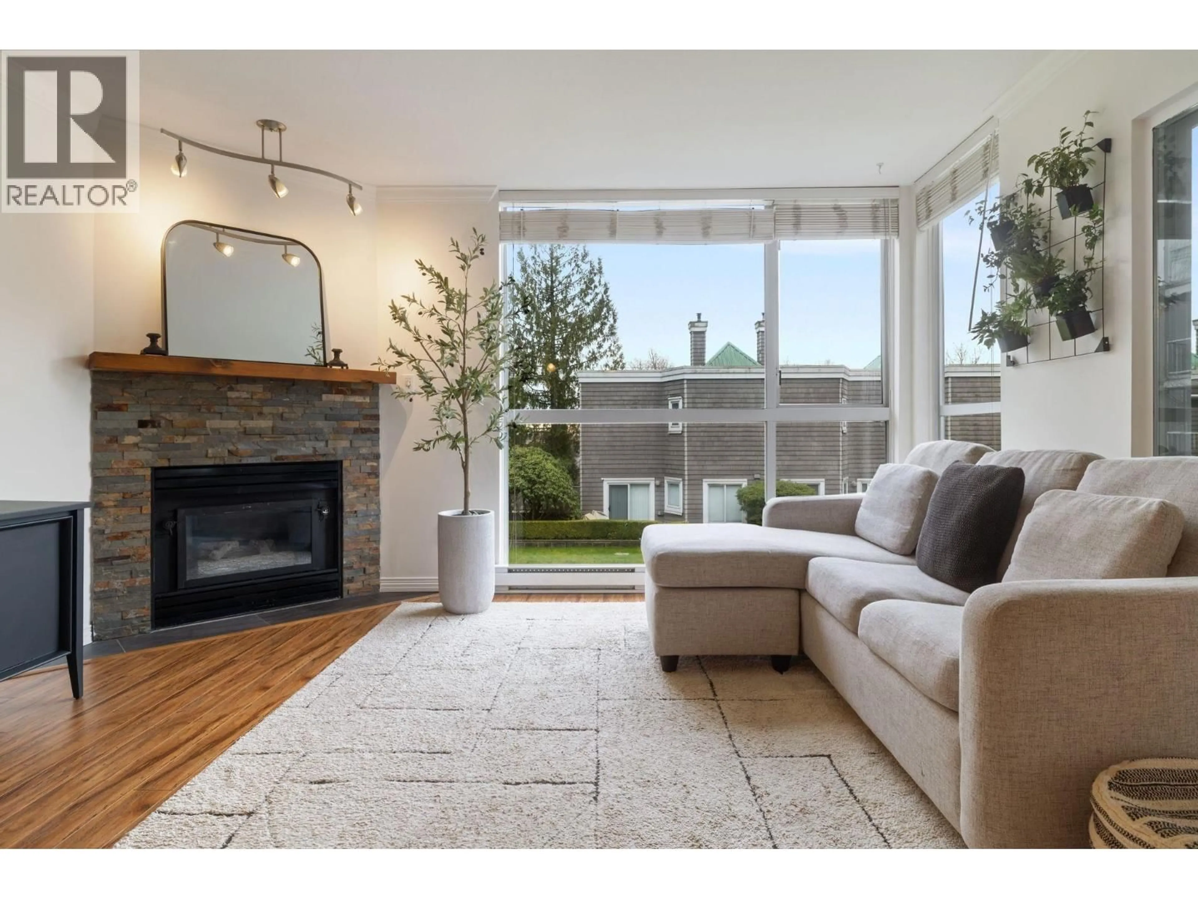 Living room with furniture, unknown for 212 - 8450 JELLICOE STREET, Vancouver British Columbia V5S4S9