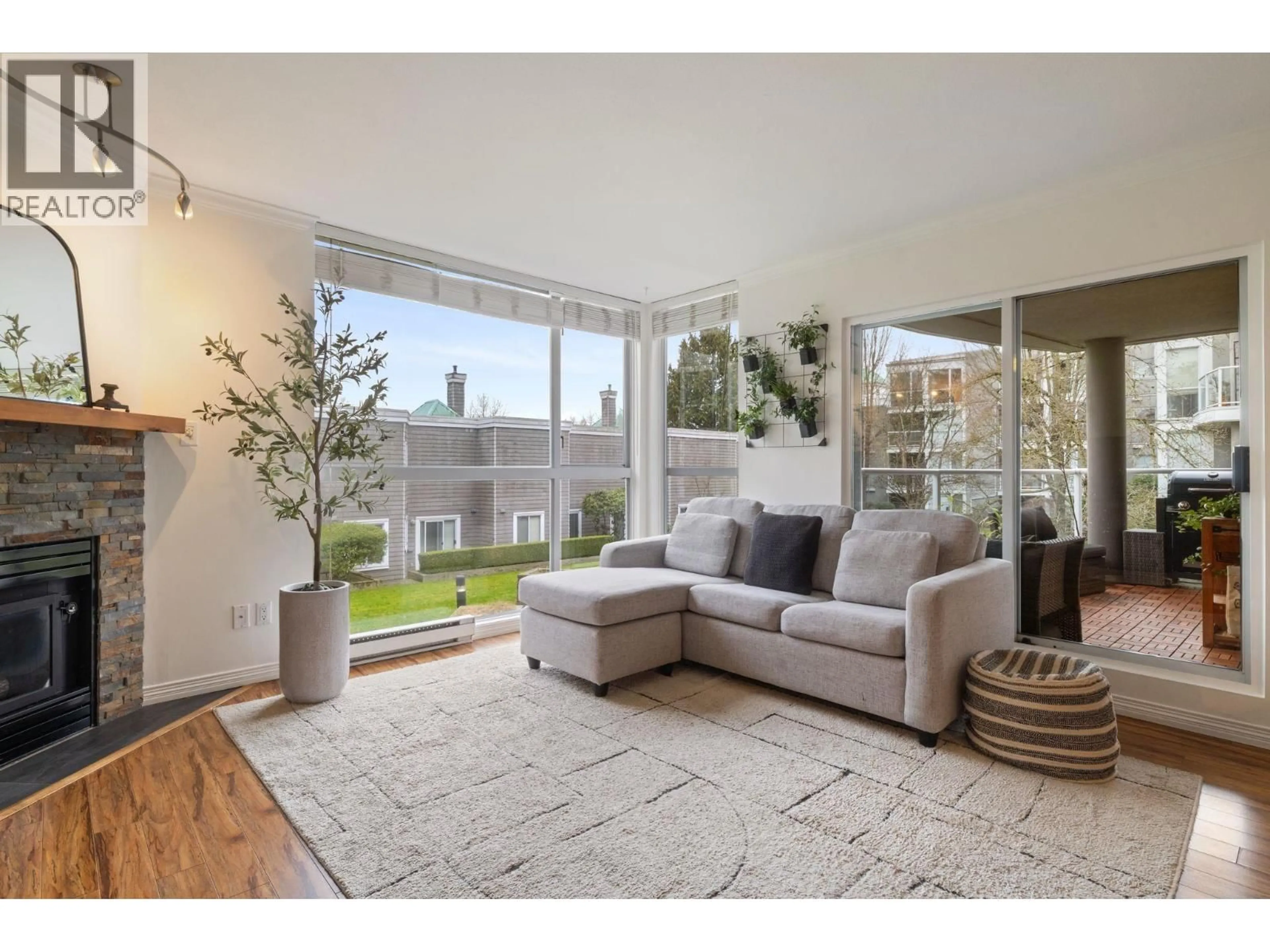 Living room with furniture, unknown for 212 - 8450 JELLICOE STREET, Vancouver British Columbia V5S4S9