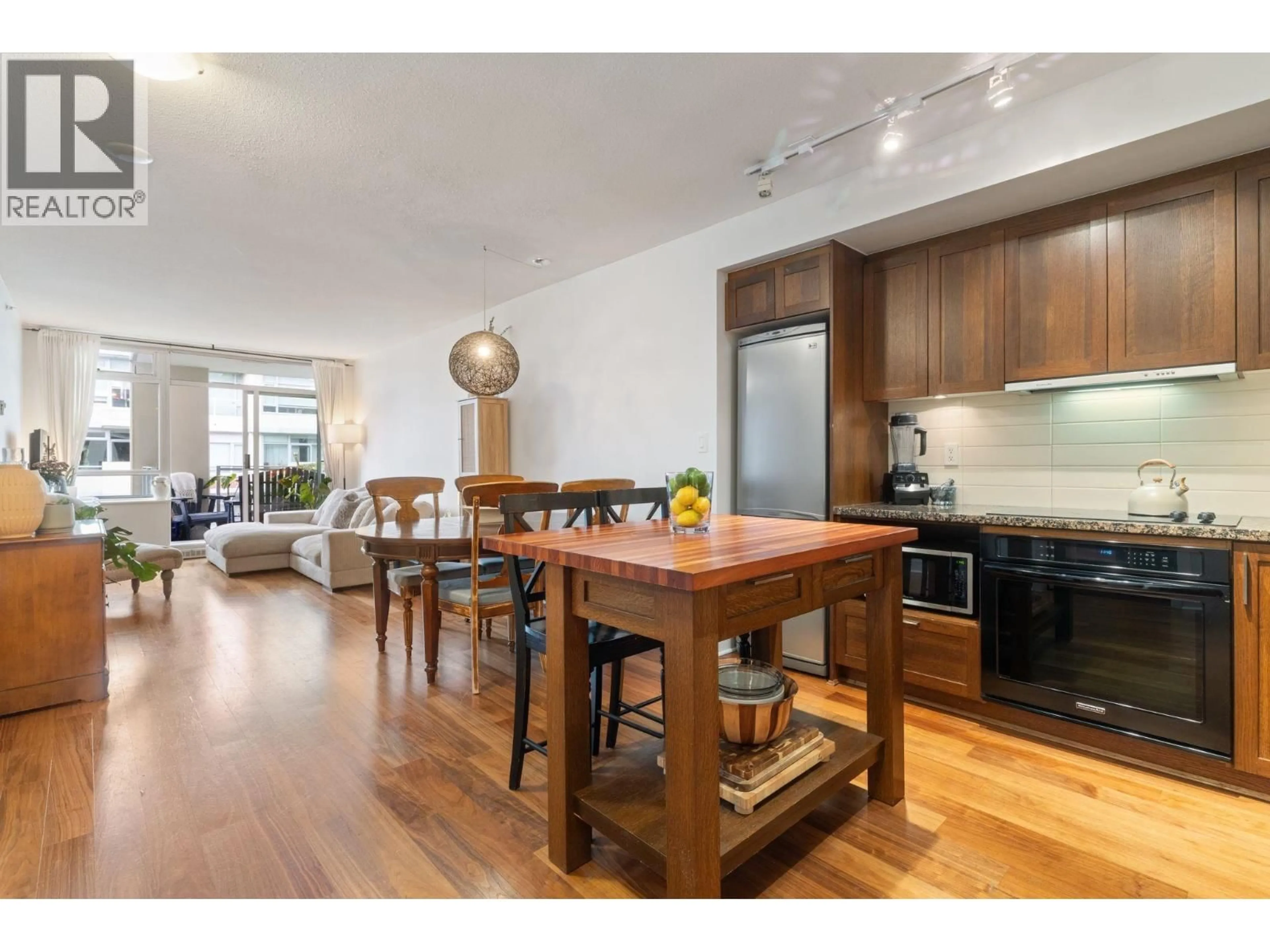 Open concept kitchen, wood/laminate floor for 608 - 2228 BROADWAY, Vancouver British Columbia V6K0B1