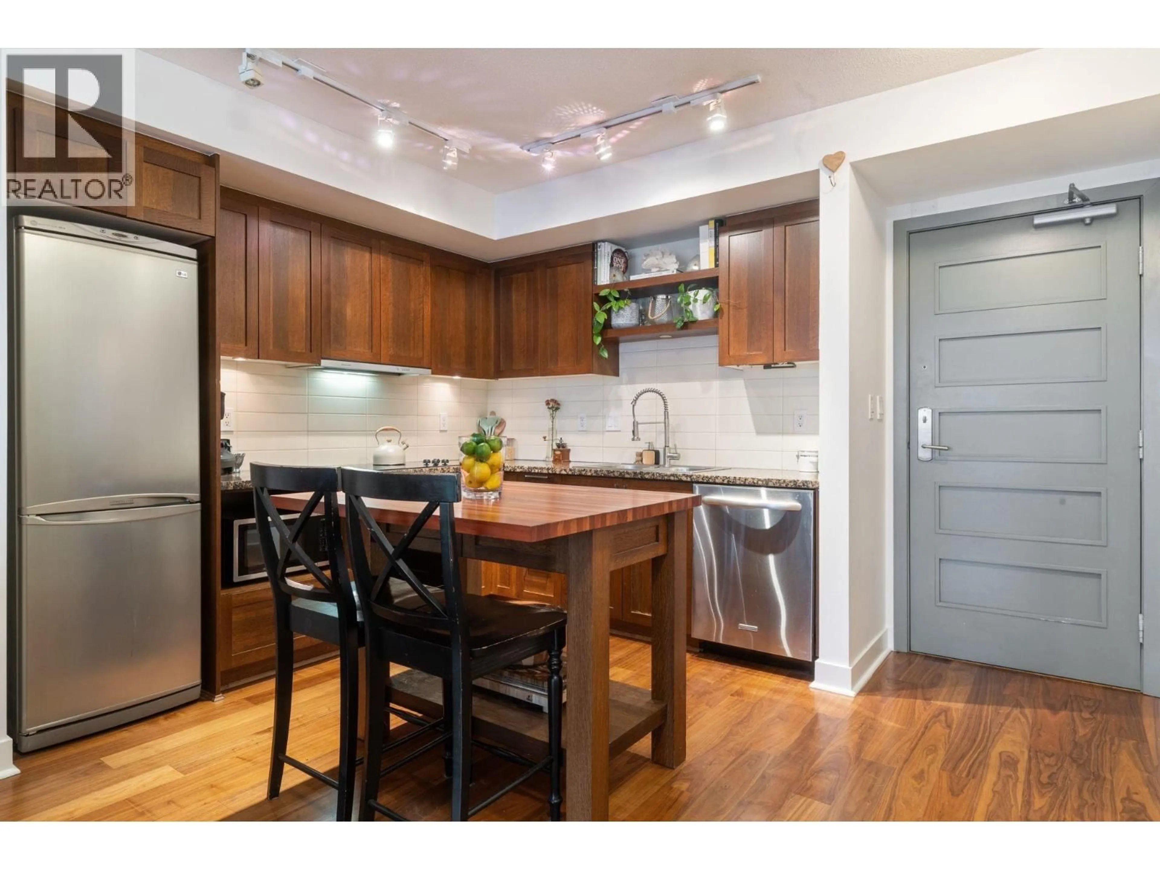 Open concept kitchen, wood/laminate floor for 608 - 2228 BROADWAY, Vancouver British Columbia V6K0B1