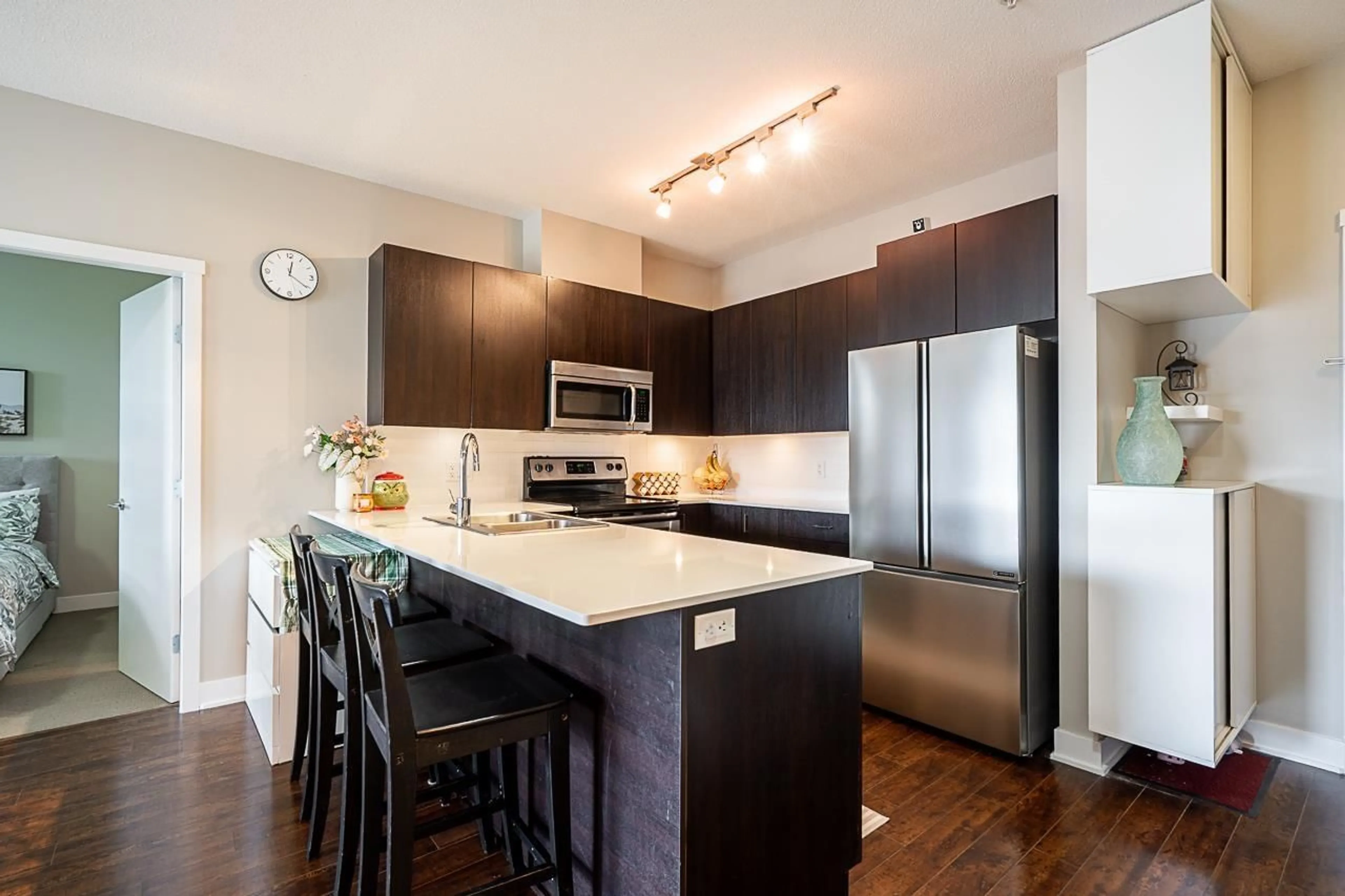 Open concept kitchen, wood/laminate floor for 309 - 20460 DOUGLAS CRESCENT, Langley British Columbia V3A0C6