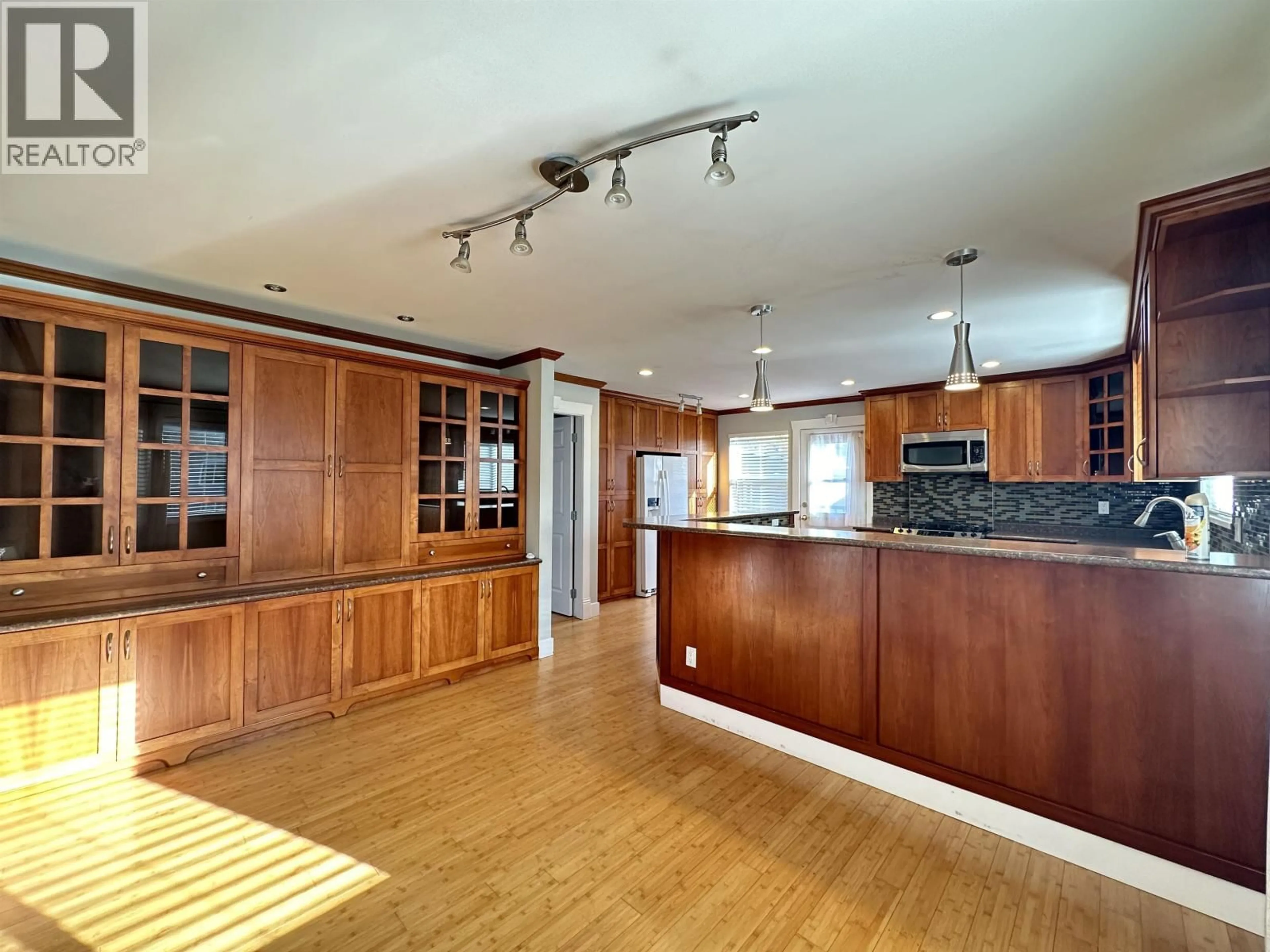 Open concept kitchen, wood/laminate floor for 5165 7B AVENUE, Delta British Columbia V4M1S3