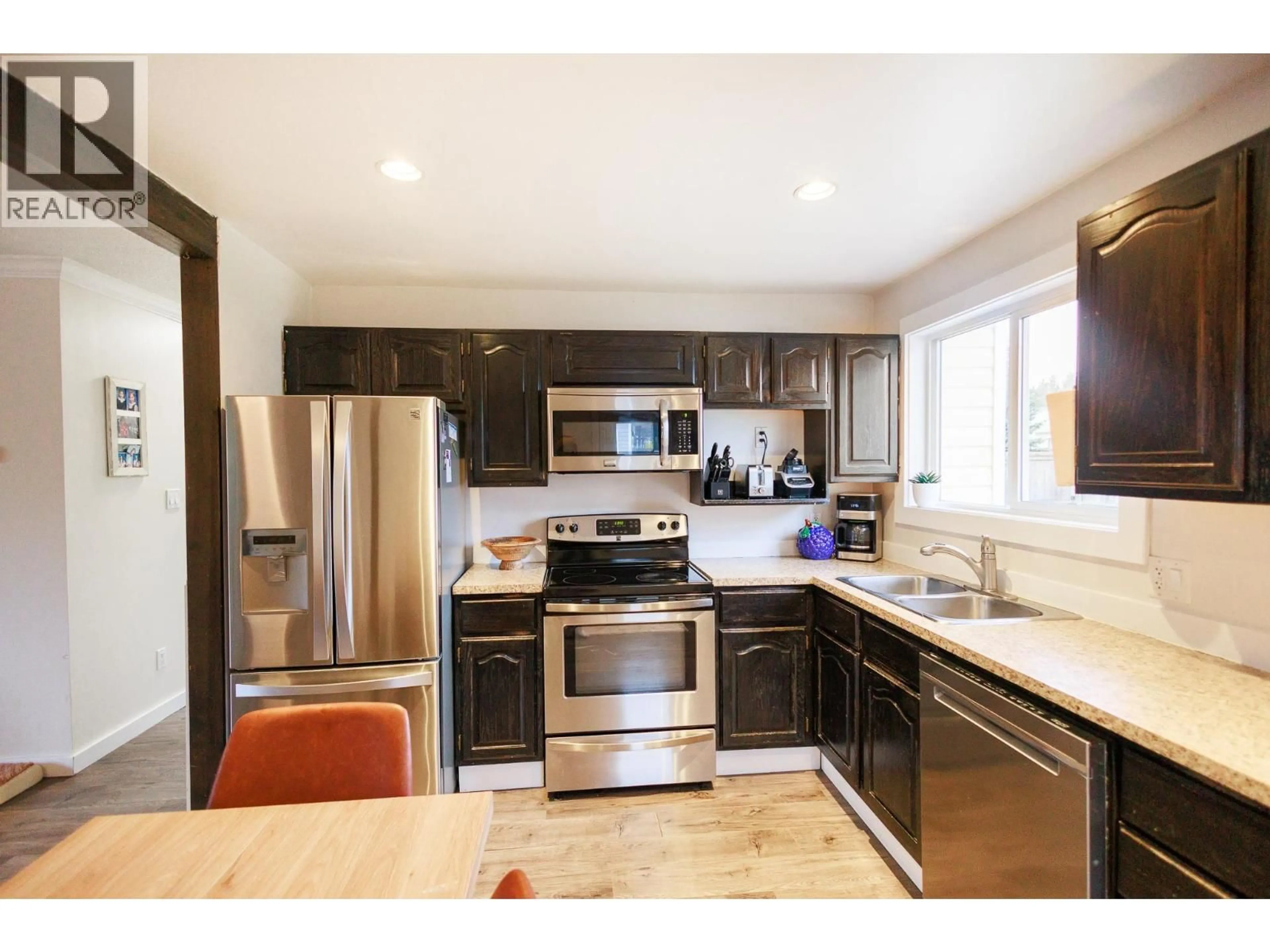 Open concept kitchen, wood/laminate floor for 4638 GRAHAM AVENUE, Terrace British Columbia V8G1A8