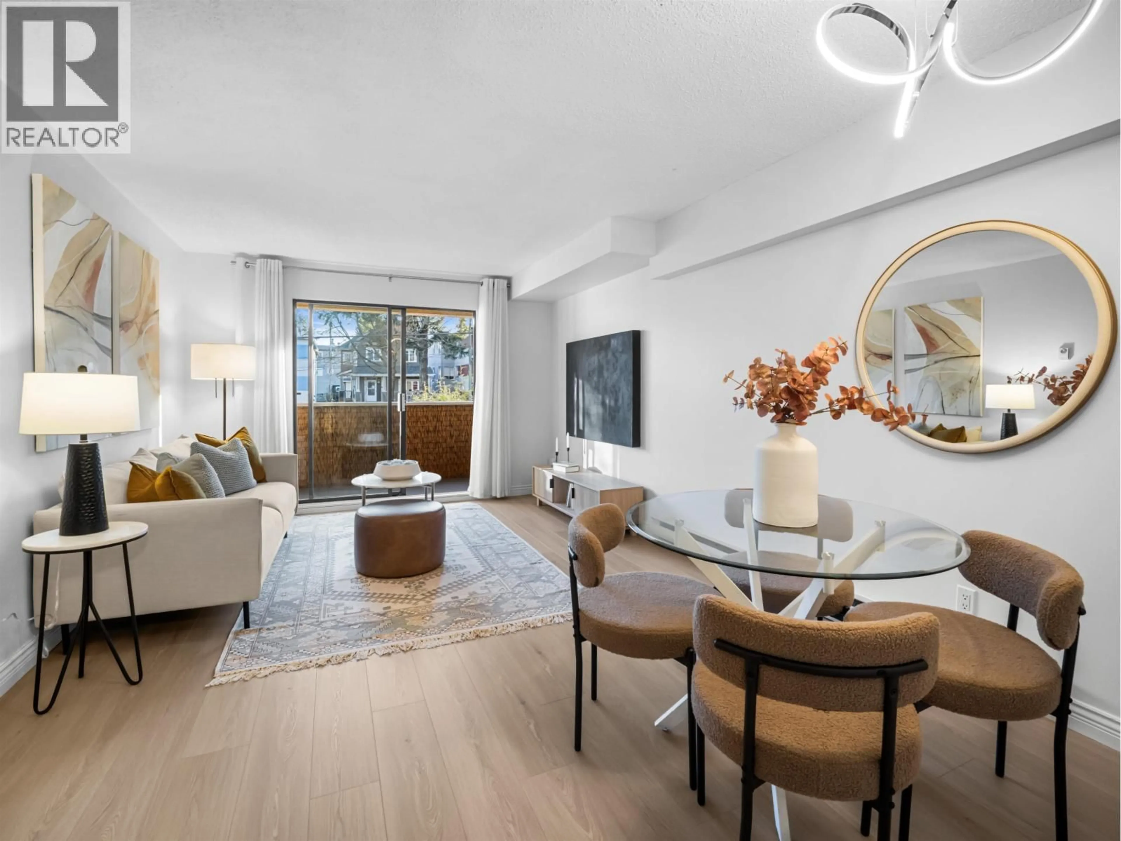 Living room with furniture, wood/laminate floor for 313 - 975 BROADWAY, Vancouver British Columbia V5T1Y3