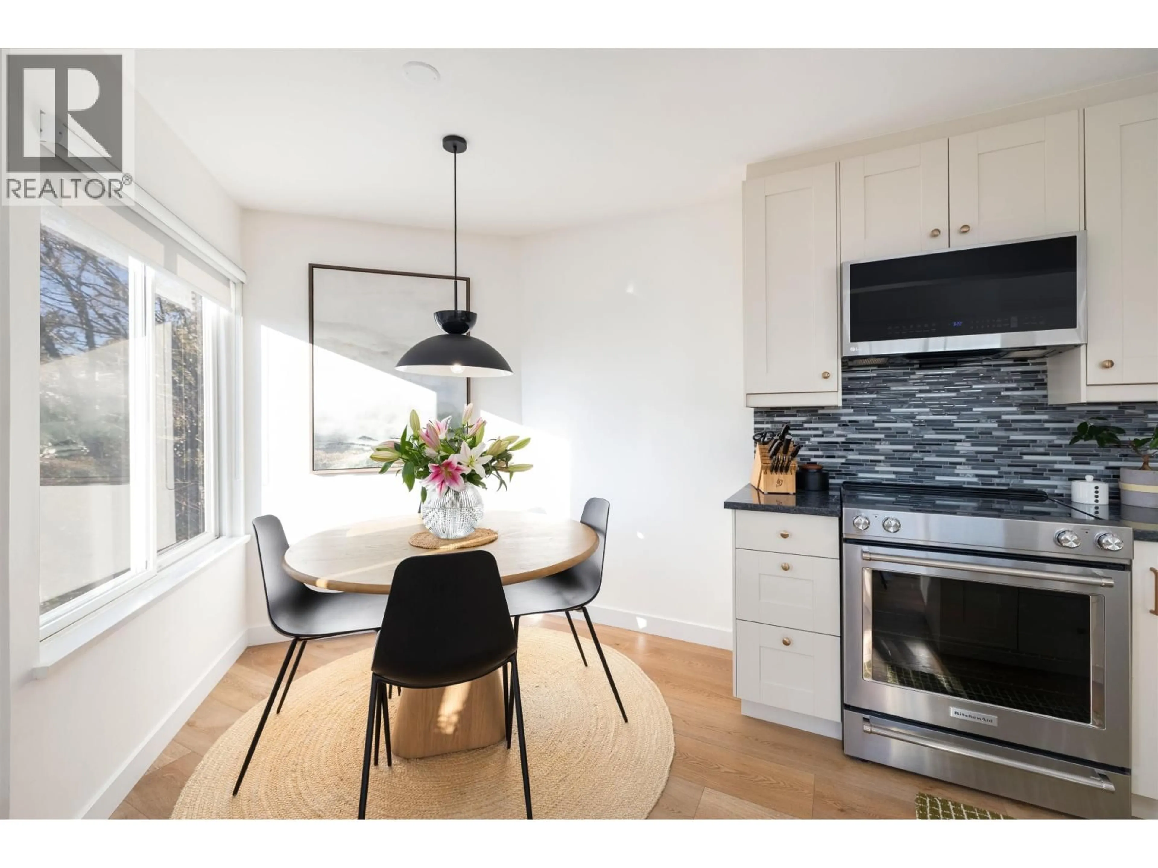 Open concept kitchen, wood/laminate floor for 416 ST. GEORGES AVENUE, North Vancouver British Columbia V7L3H1