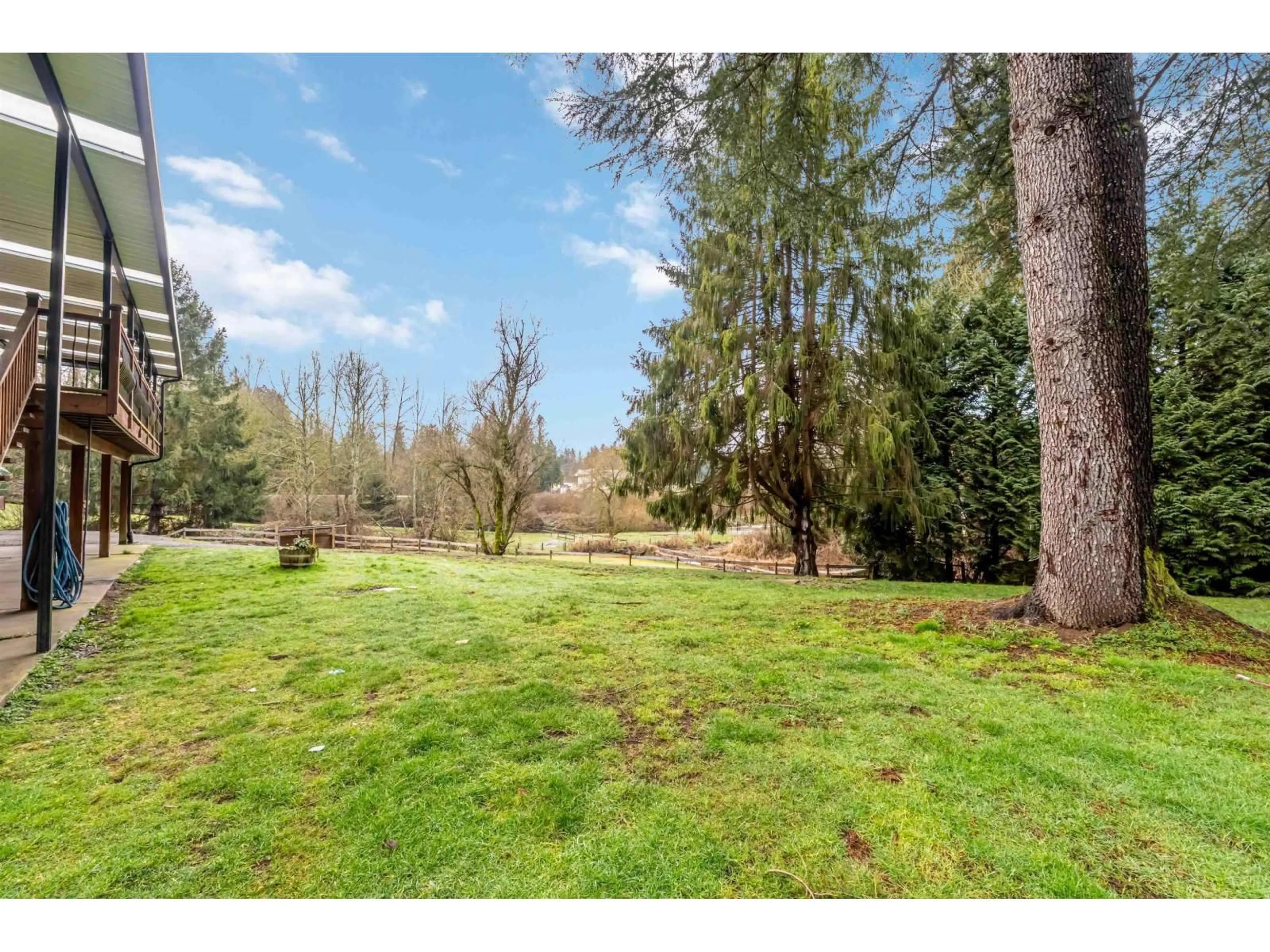 A pic from outside/outdoor area/front of a property/back of a property/a pic from drone, forest/trees view for 22990 70A AVENUE, Langley British Columbia V2Y2J9