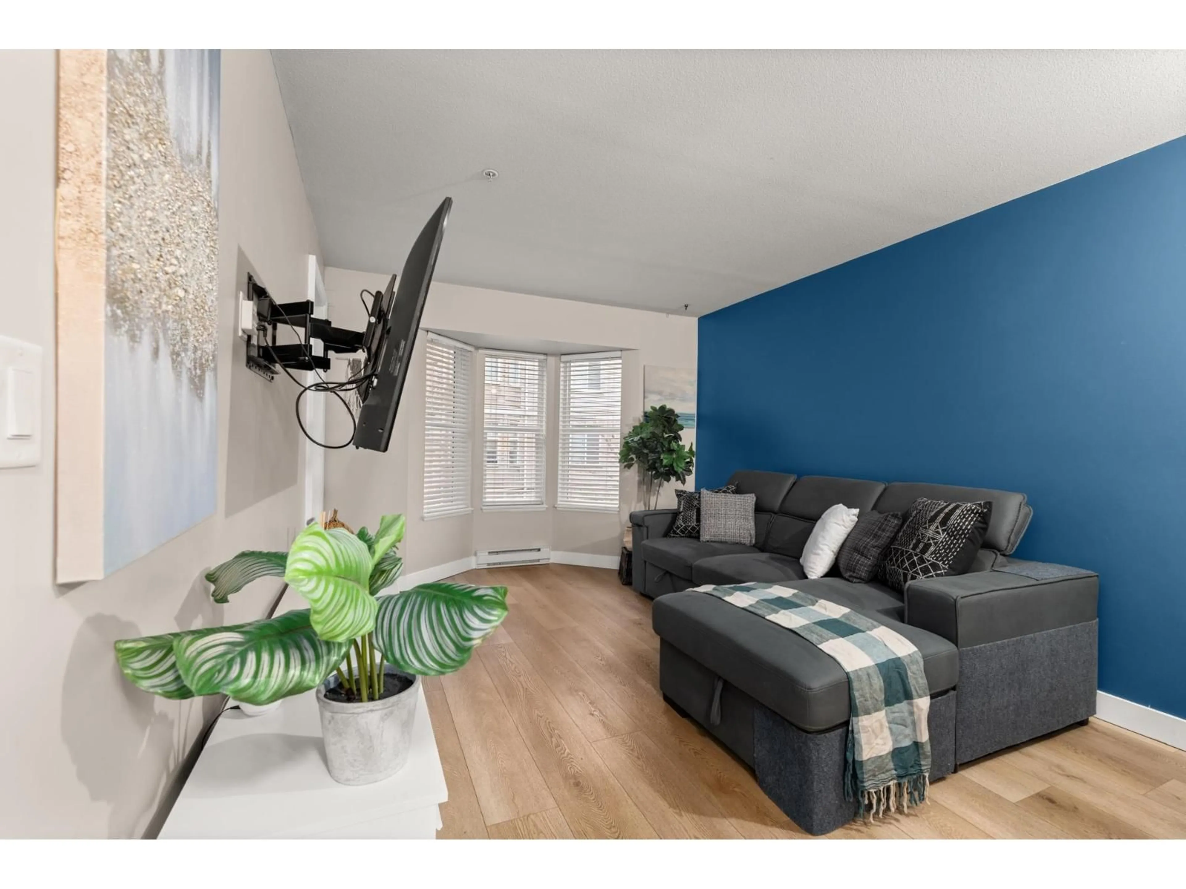 Living room with furniture, wood/laminate floor for 204 - 5454 198 STREET, Langley British Columbia V3A1G2