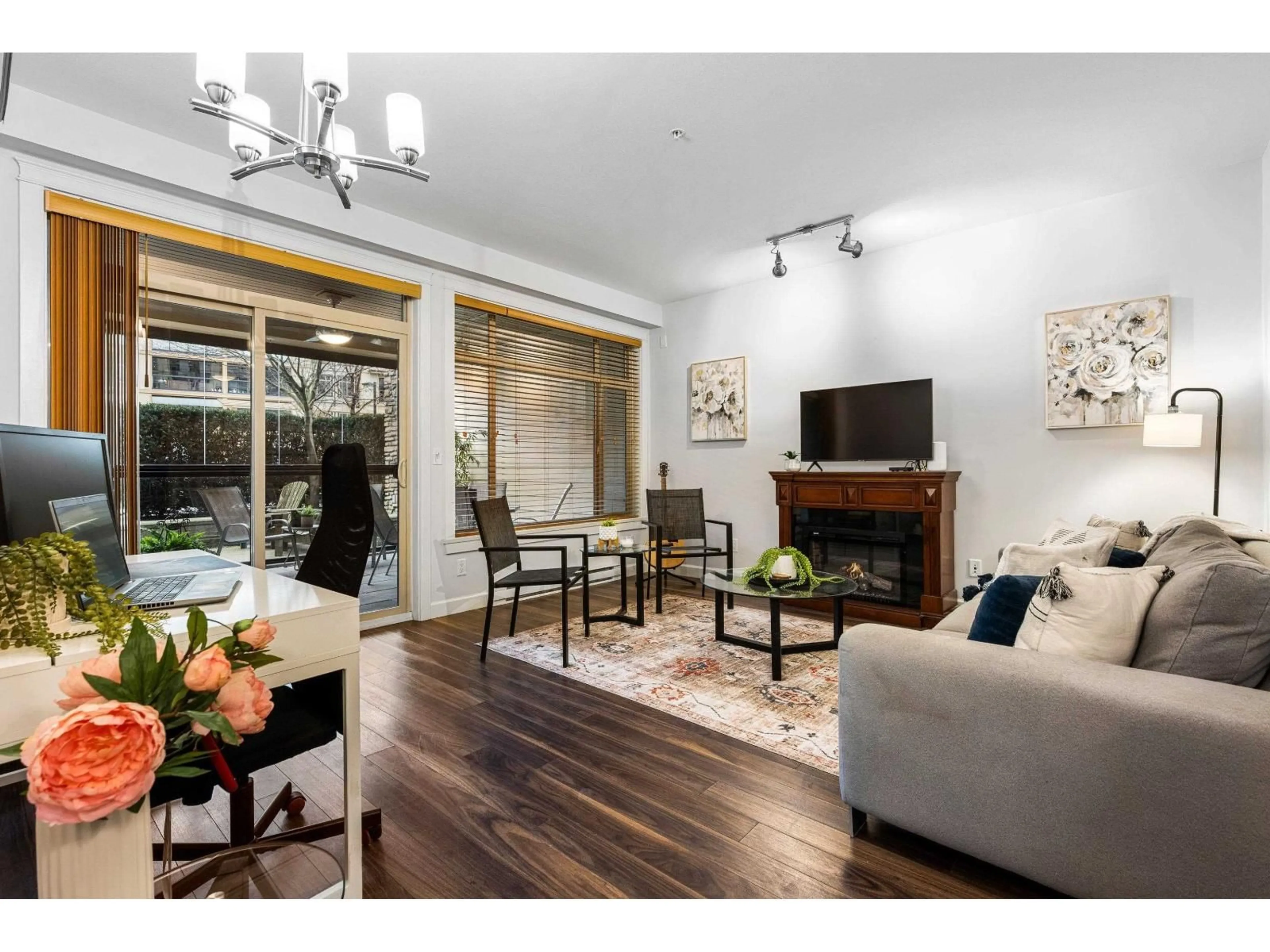 Living room with furniture, wood/laminate floor for 109 - 2860 TRETHEWEY STREET, Abbotsford British Columbia V2T0G5