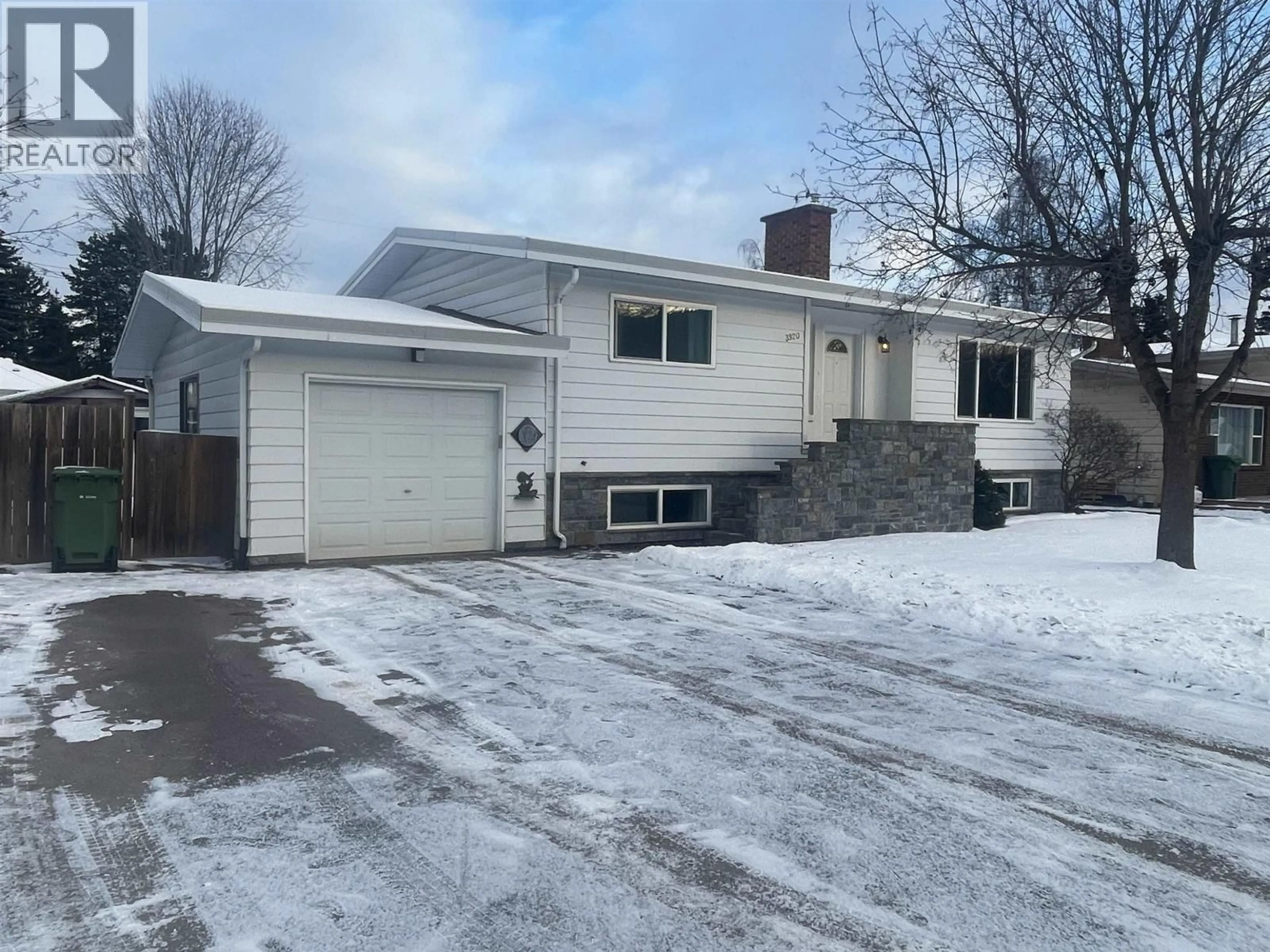 A pic from outside/outdoor area/front of a property/back of a property/a pic from drone, street for 3920 11TH AVENUE, Smithers British Columbia V0J2N0