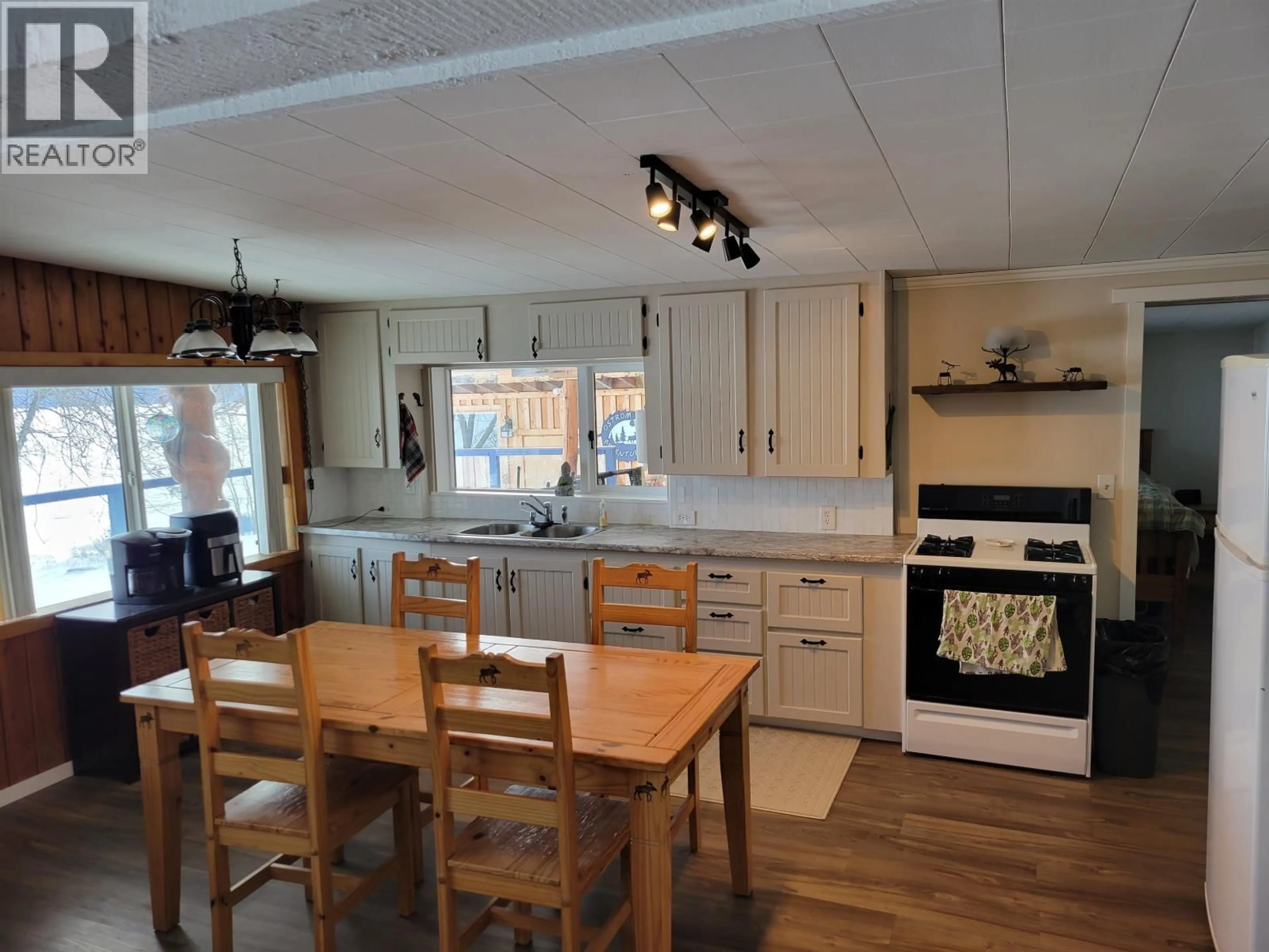 Open concept kitchen, wood/laminate floor for 4780 MANCA PLACE, Fraser Lake British Columbia V0J1S0
