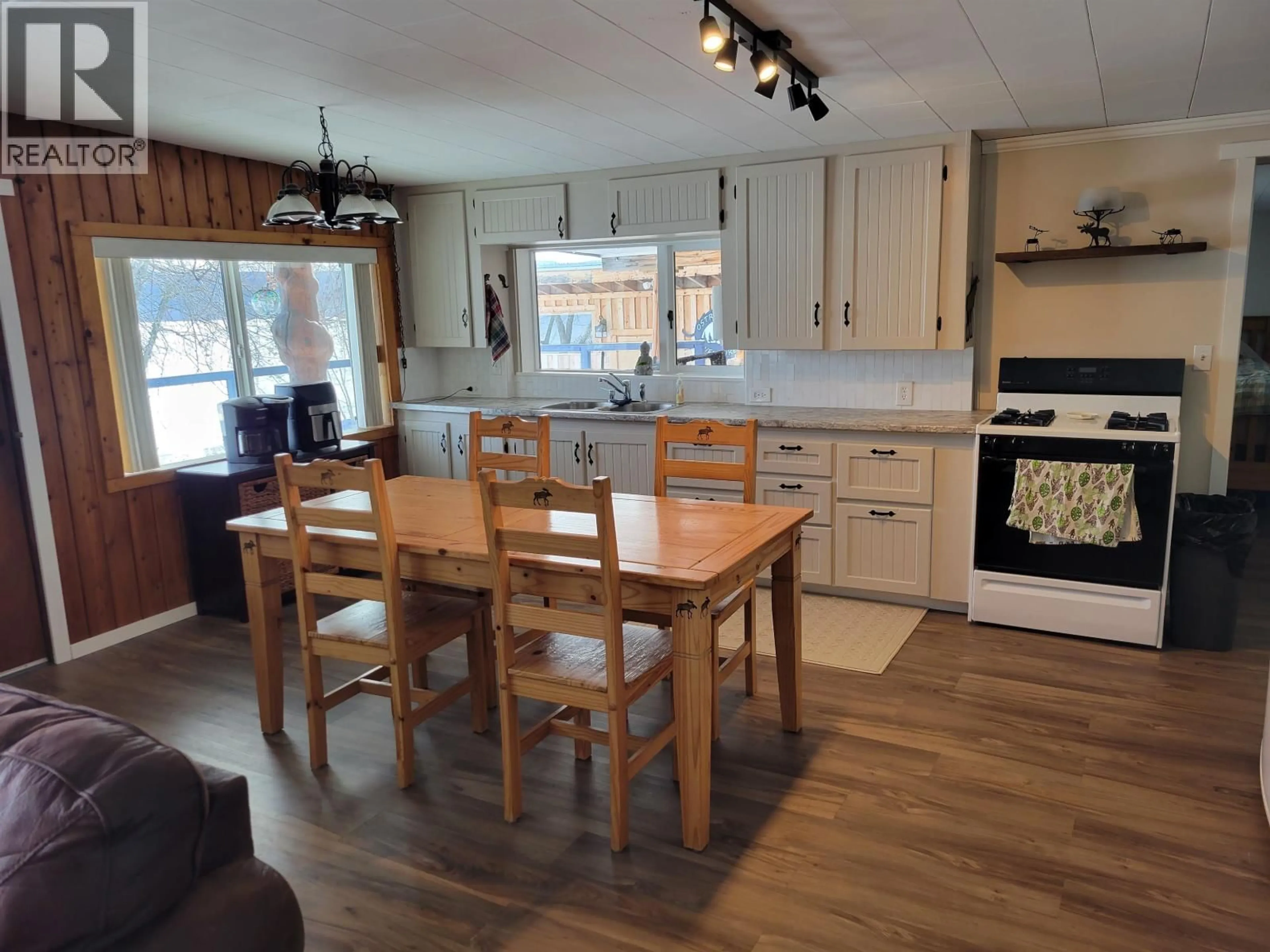 Open concept kitchen, wood/laminate floor for 4780 MANCA PLACE, Fraser Lake British Columbia V0J1S0
