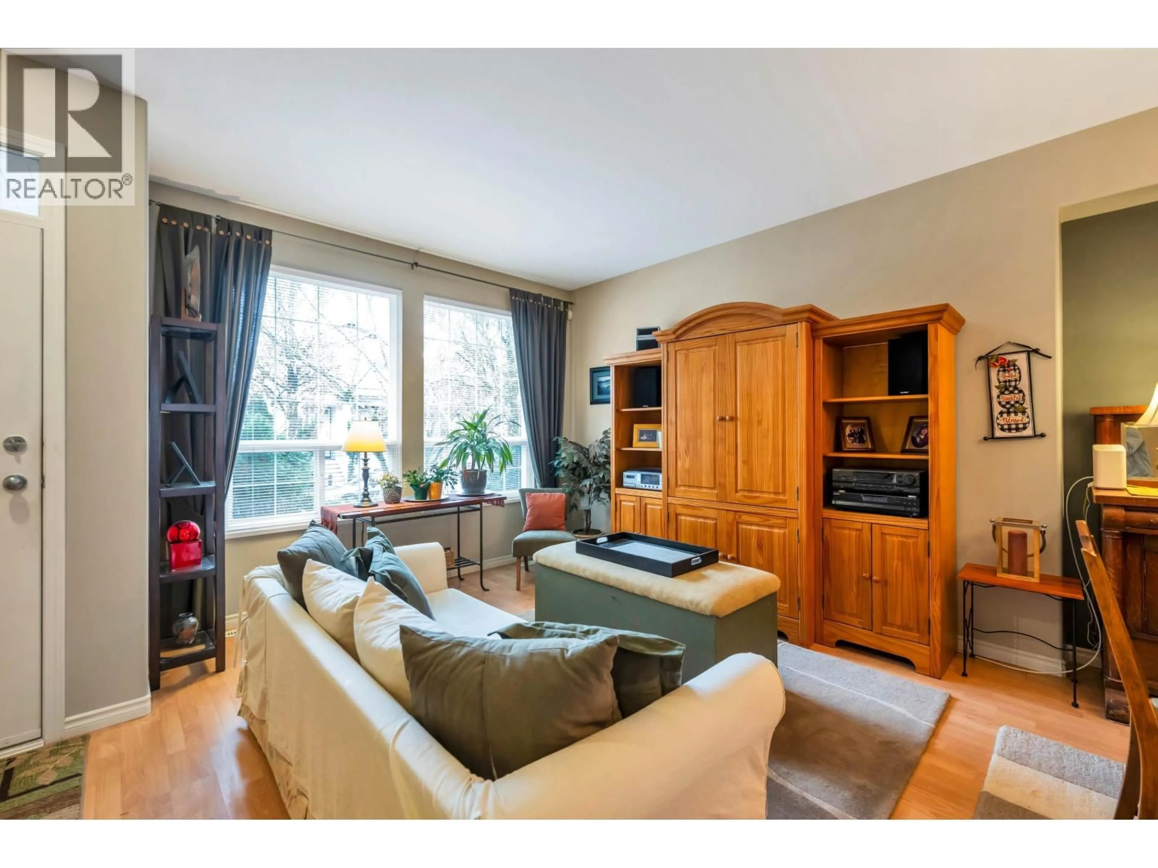 Living room with furniture, wood/laminate floor for 24121 102A AVENUE, Maple Ridge British Columbia V2W2B3