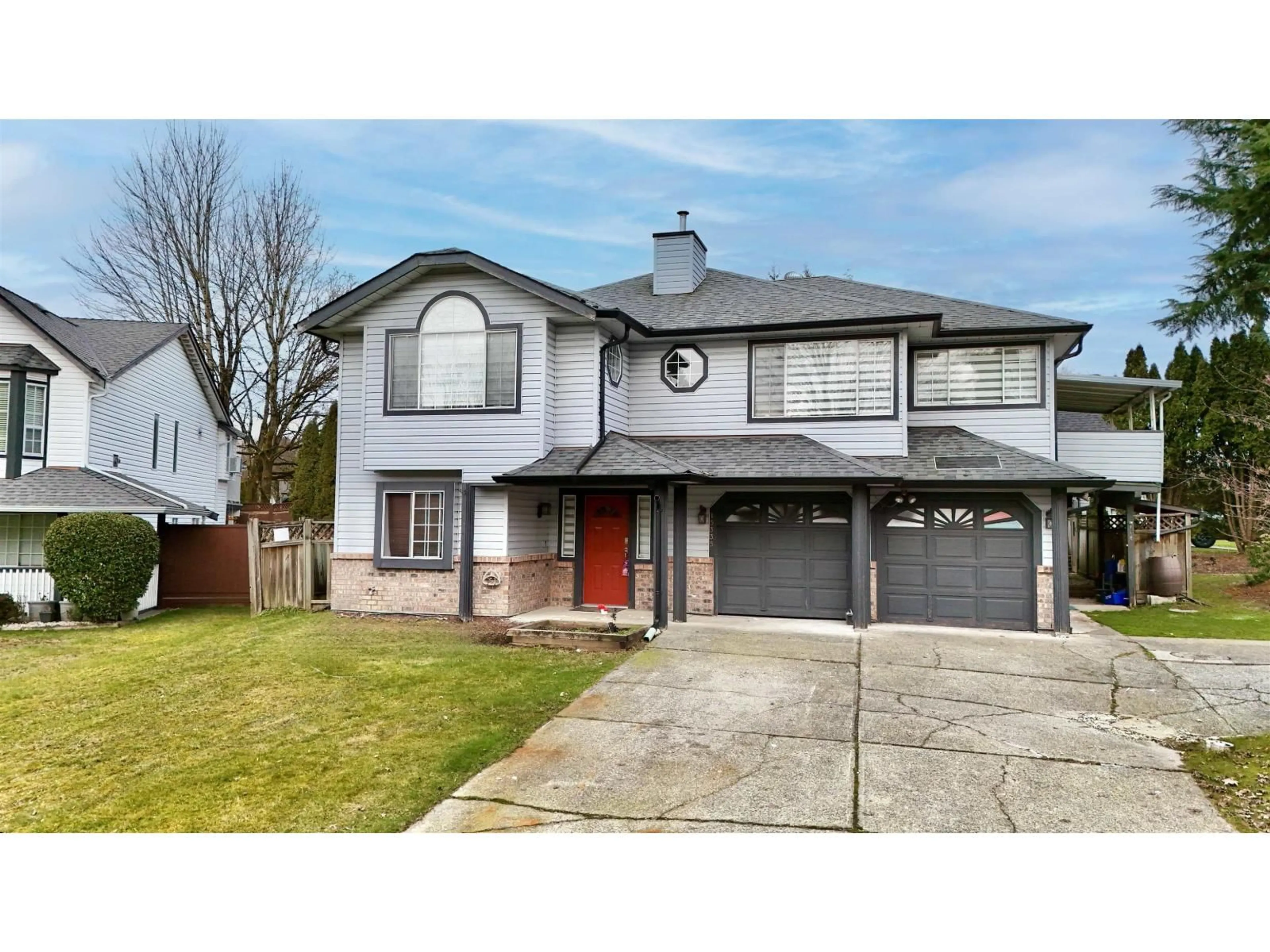 Home with vinyl exterior material, street for 15335 111 AVENUE, Surrey British Columbia V3R9H7