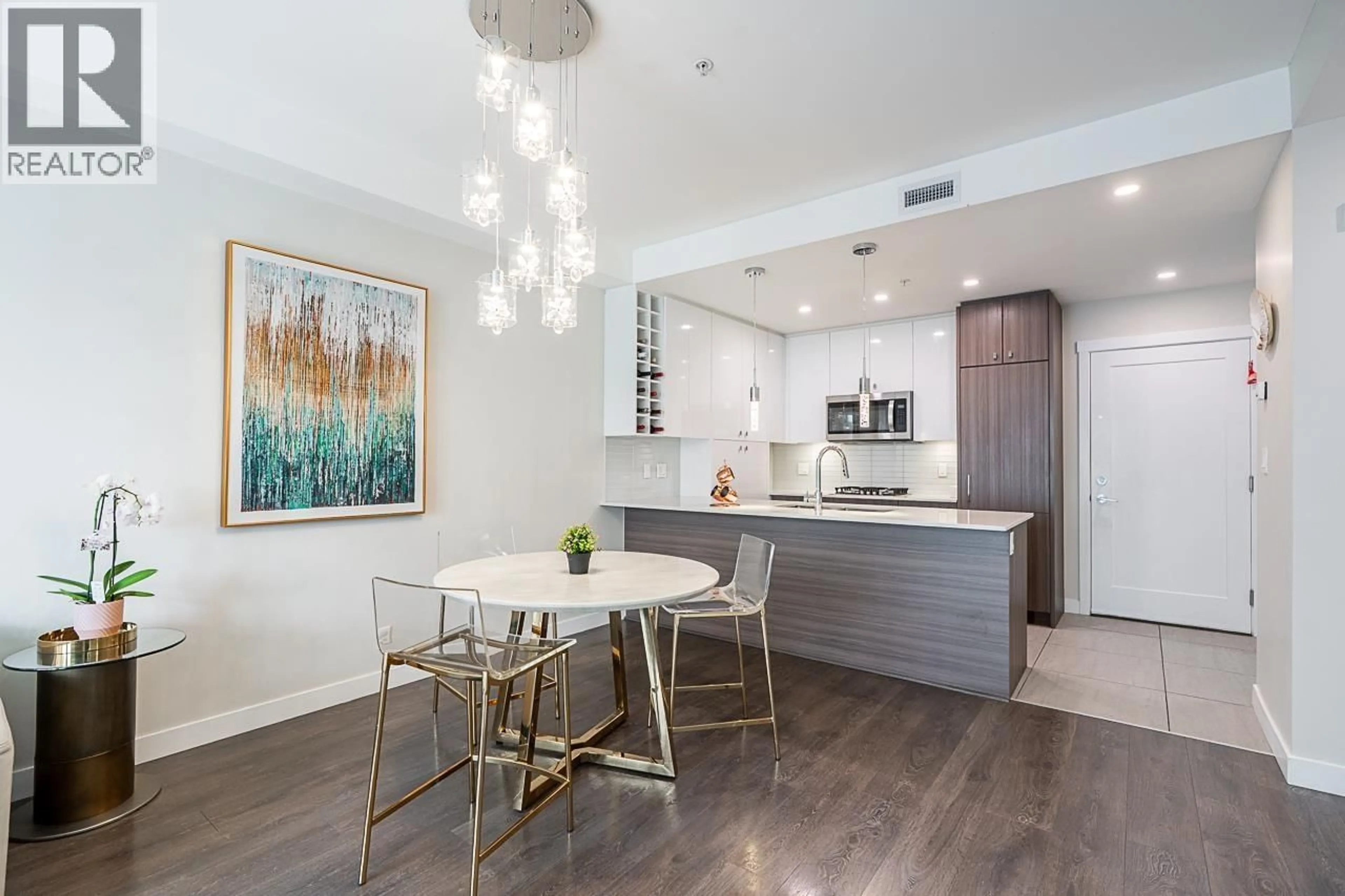 Open concept kitchen, wood/laminate floor for 204 - 23233 GILLEY ROAD, Richmond British Columbia V6V1E6