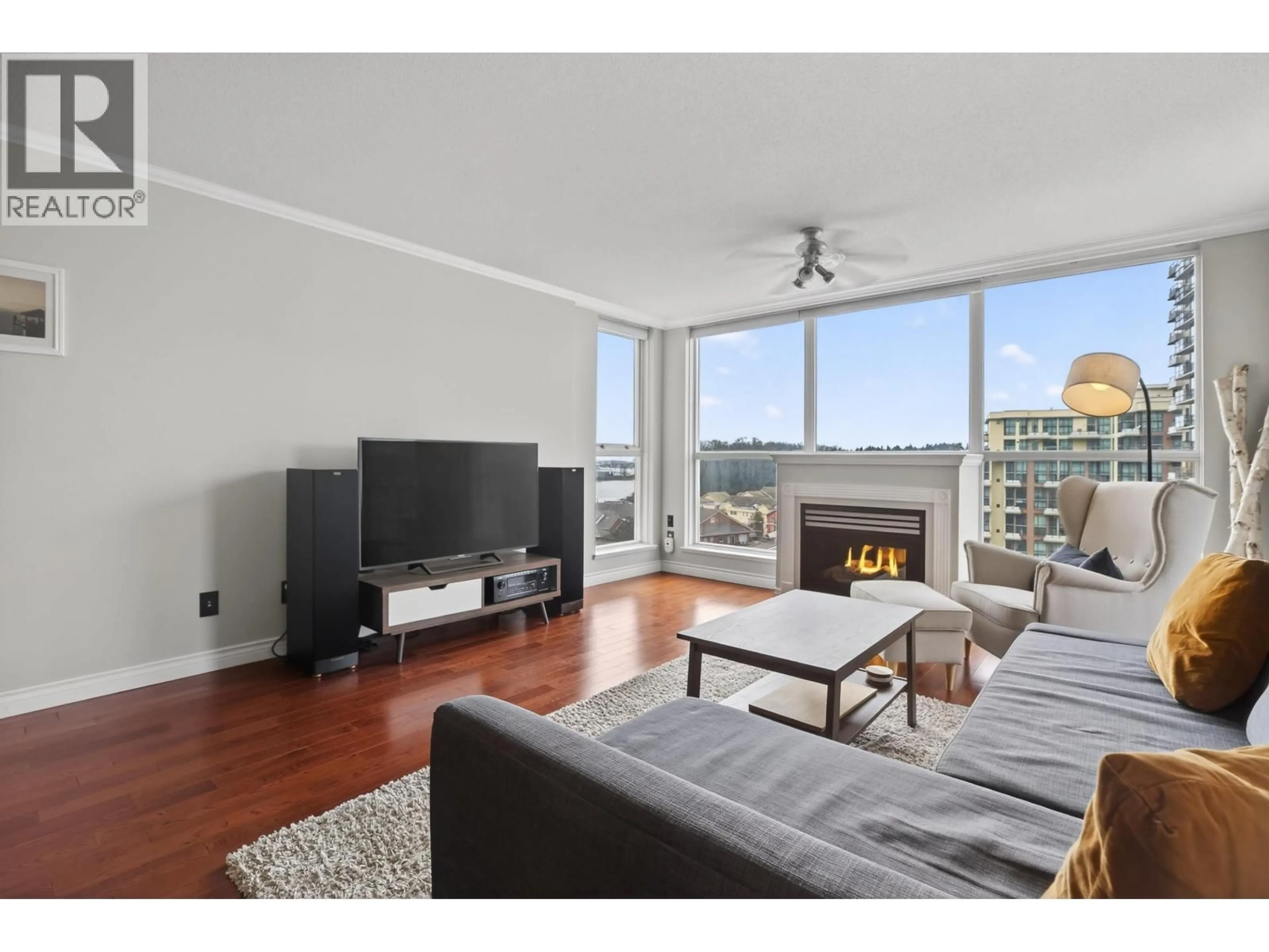 Living room with furniture, wood/laminate floor for 1007 - 10 LAGUNA COURT, New Westminster British Columbia V3M6W3