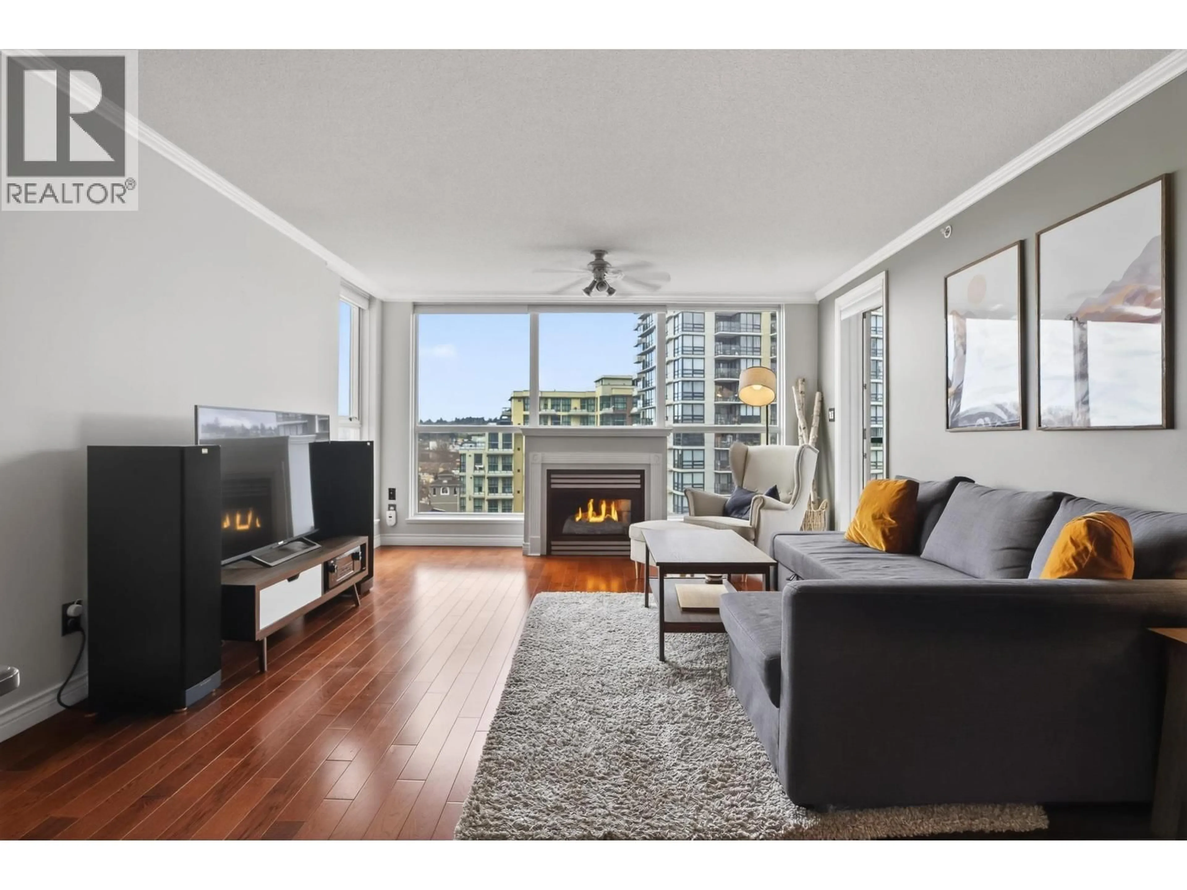 Living room with furniture, wood/laminate floor for 1007 - 10 LAGUNA COURT, New Westminster British Columbia V3M6W3