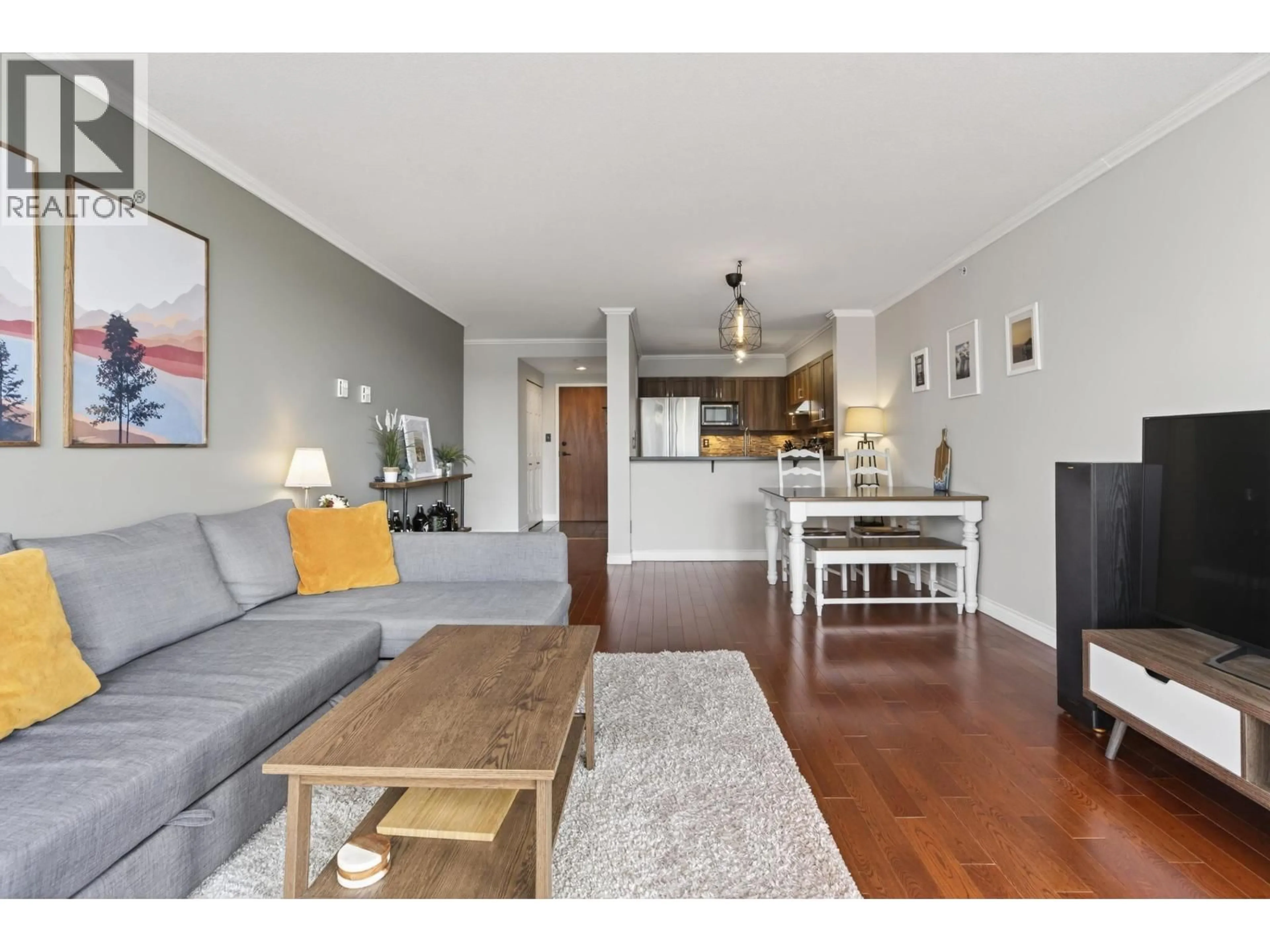 Living room with furniture, wood/laminate floor for 1007 - 10 LAGUNA COURT, New Westminster British Columbia V3M6W3