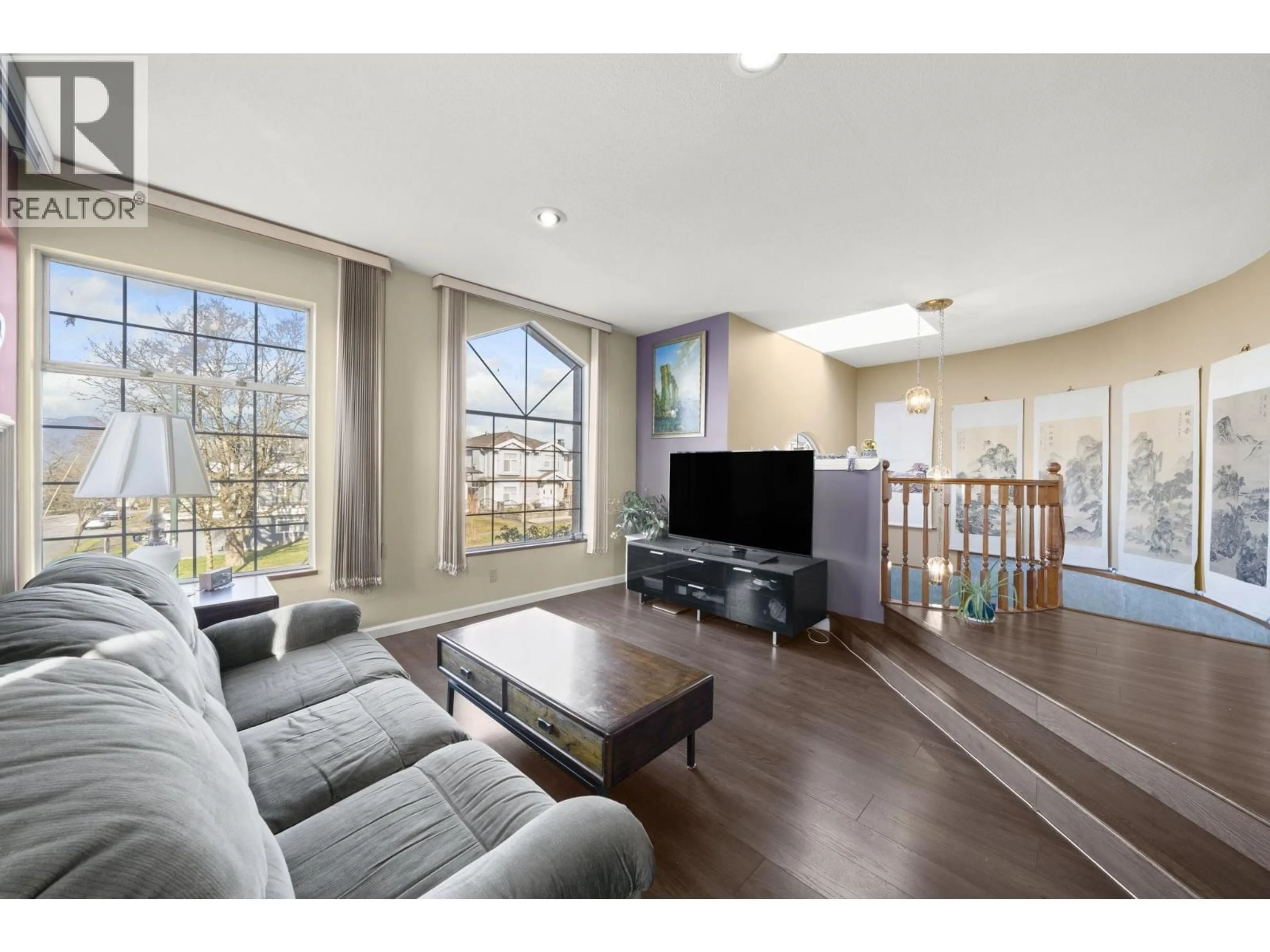 Living room with furniture, wood/laminate floor for 3206 25TH AVENUE, Vancouver British Columbia V5R1J6