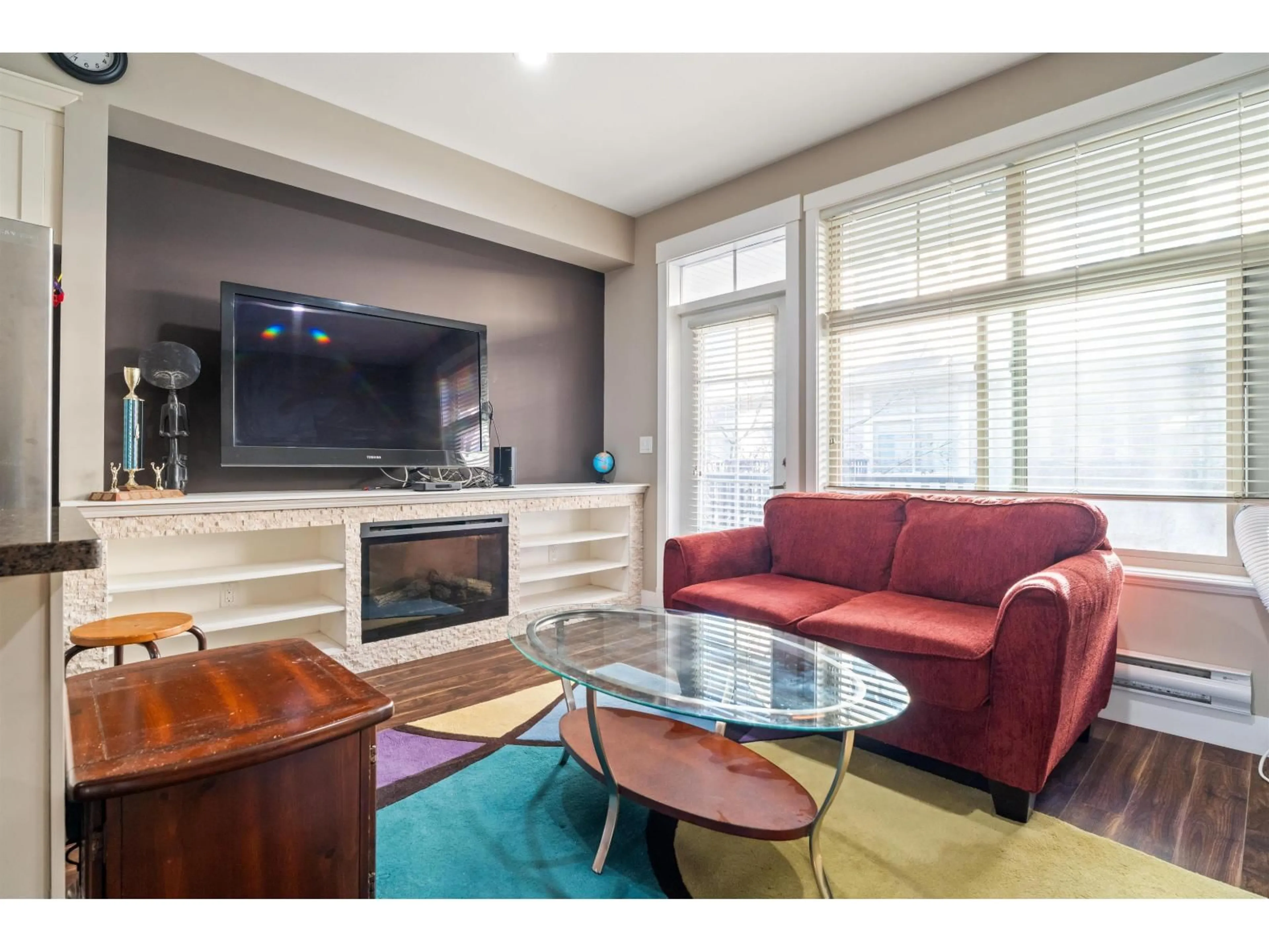 Living room with furniture, wood/laminate floor for 30 - 19525 73 AVENUE, Surrey British Columbia V4N6L7