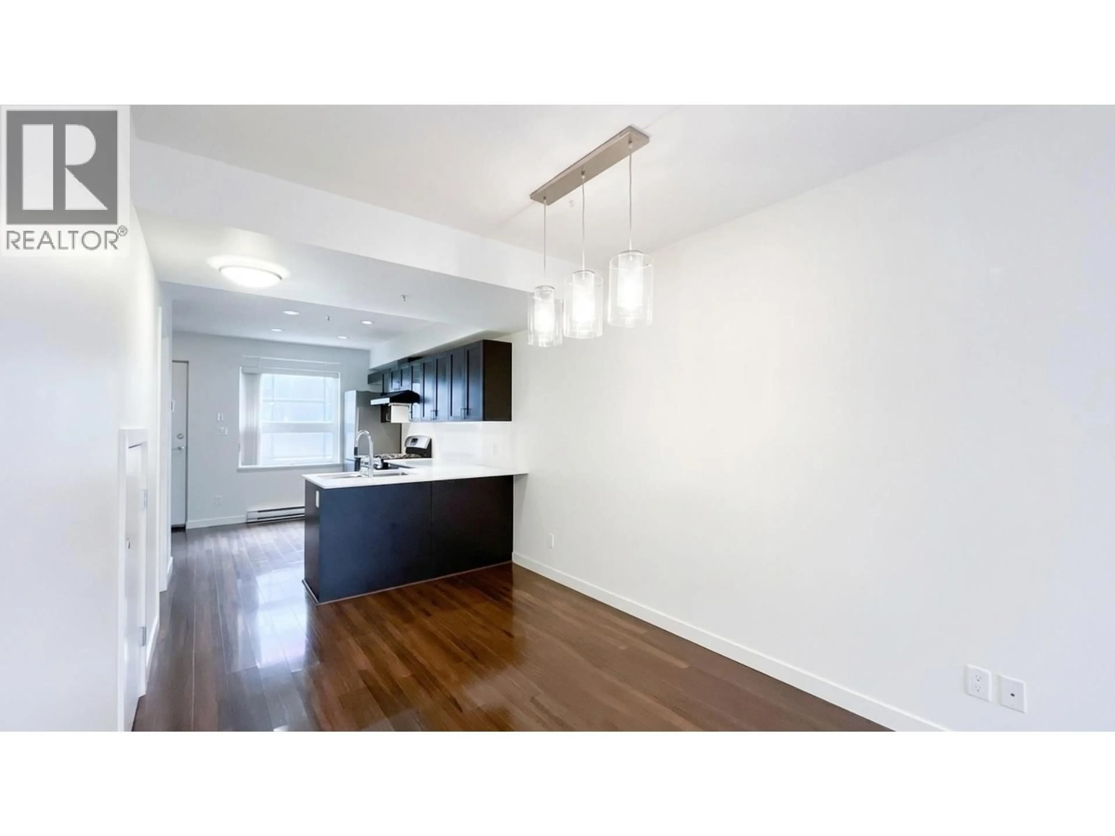 Open concept kitchen, wood/laminate floor for 4888 ELDORADO MEWS, Vancouver British Columbia V5R0B1