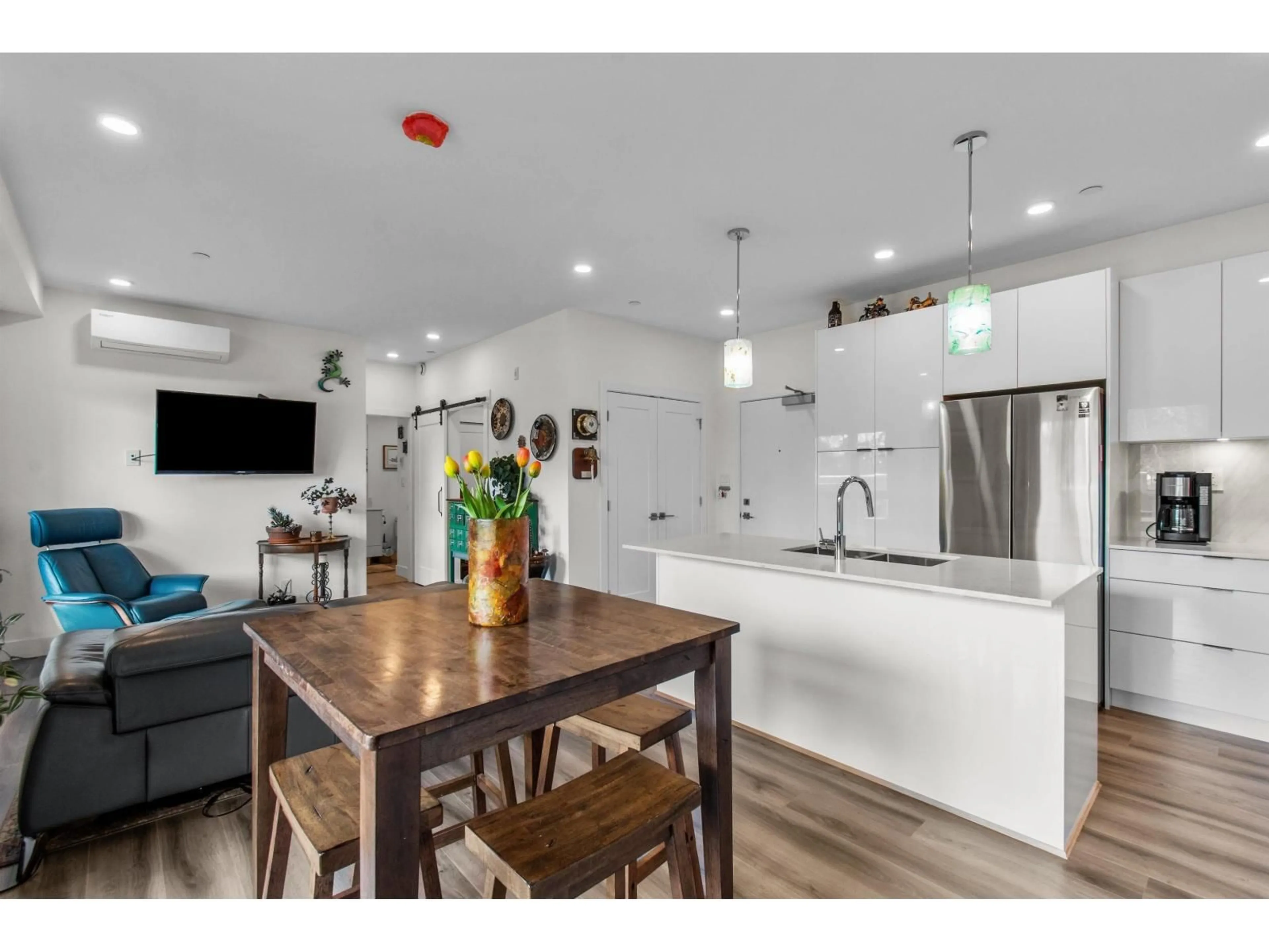 Open concept kitchen, wood/laminate floor for A506 - 8447 202 STREET, Langley British Columbia V2Y2B7