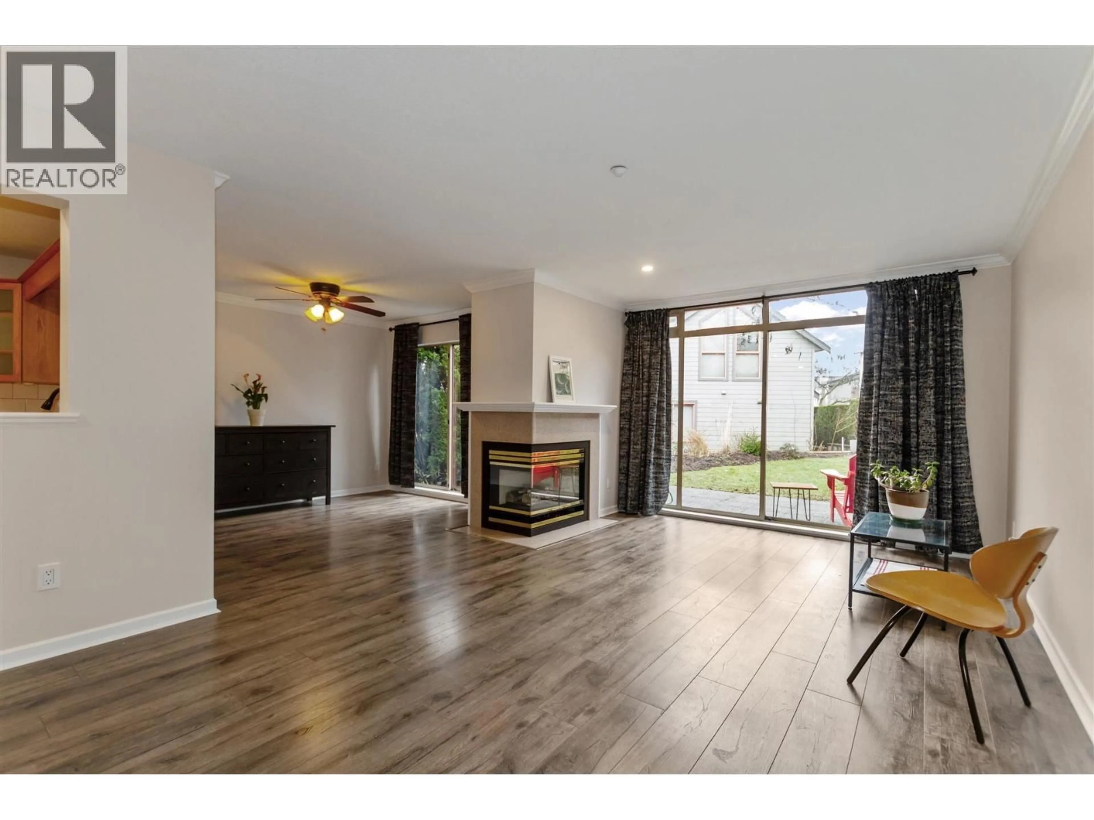 Living room with furniture, wood/laminate floor for 79 - 323 GOVERNORS COURT, New Westminster British Columbia V3L5S6