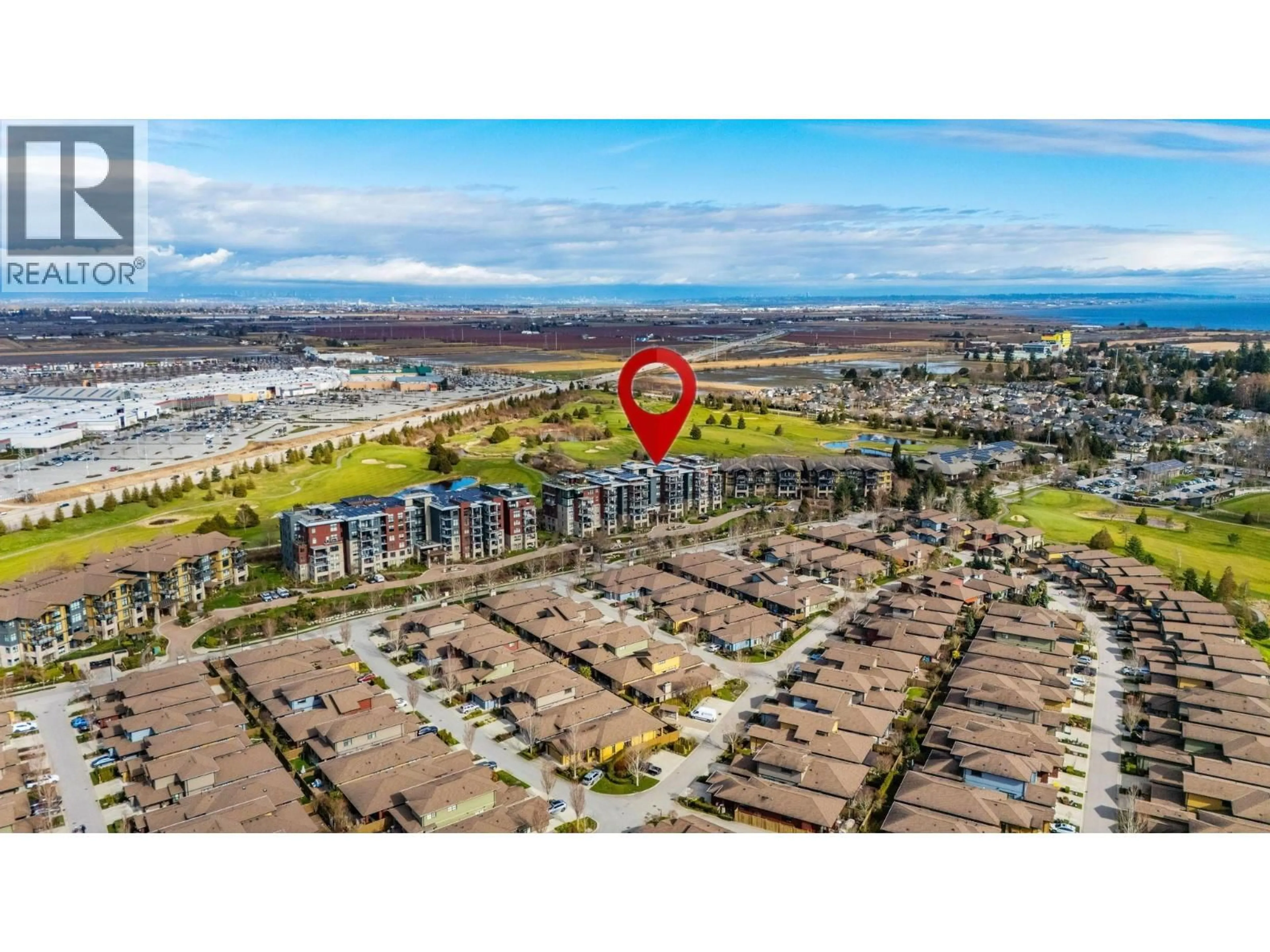 A pic from outside/outdoor area/front of a property/back of a property/a pic from drone, water/lake/river/ocean view for 211 - 5055 SPRINGS BOULEVARD, Delta British Columbia V4M0A5