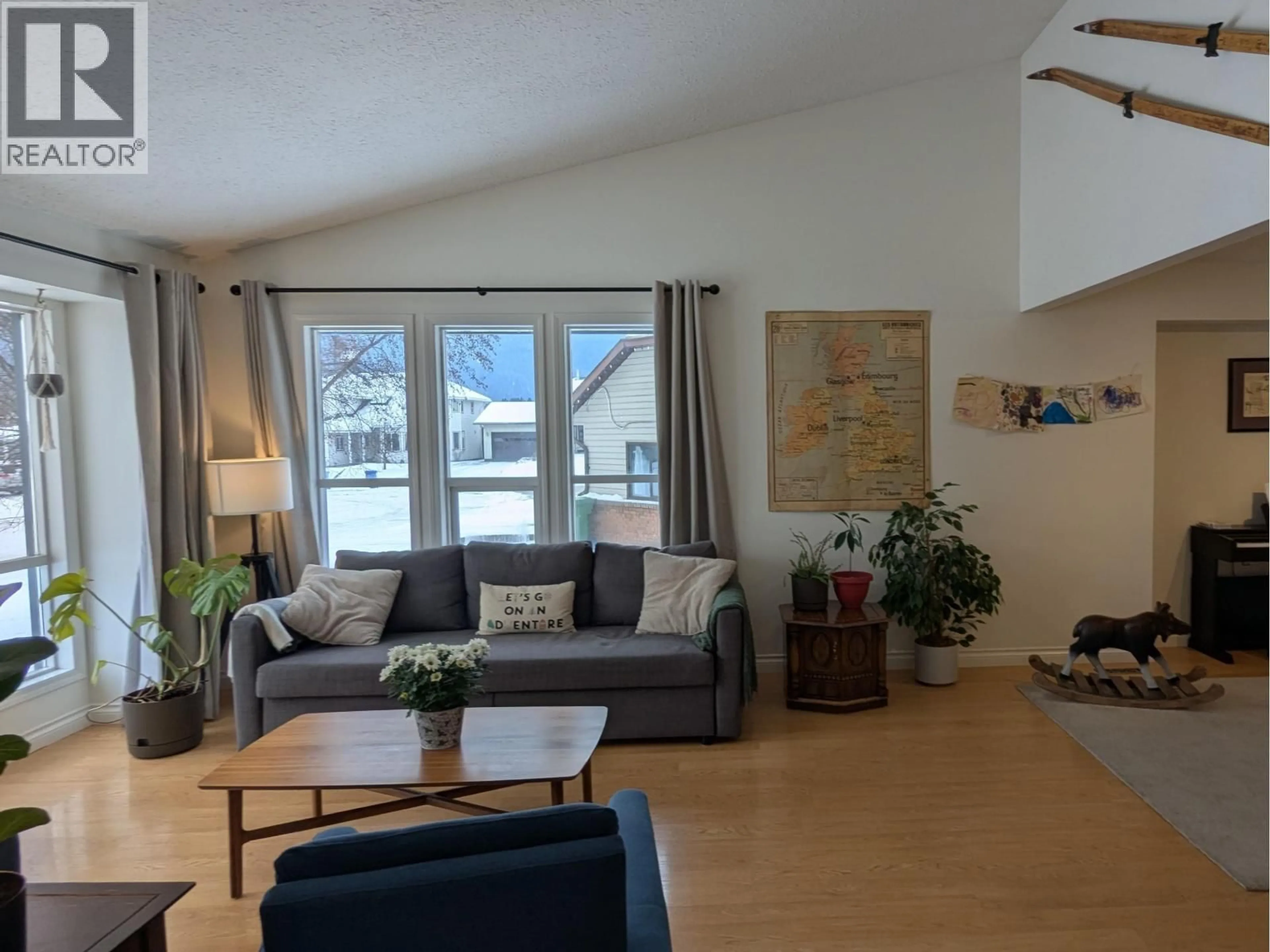 Living room with furniture, wood/laminate floor for 1373 CRONIN PLACE, Smithers British Columbia V0J2N0