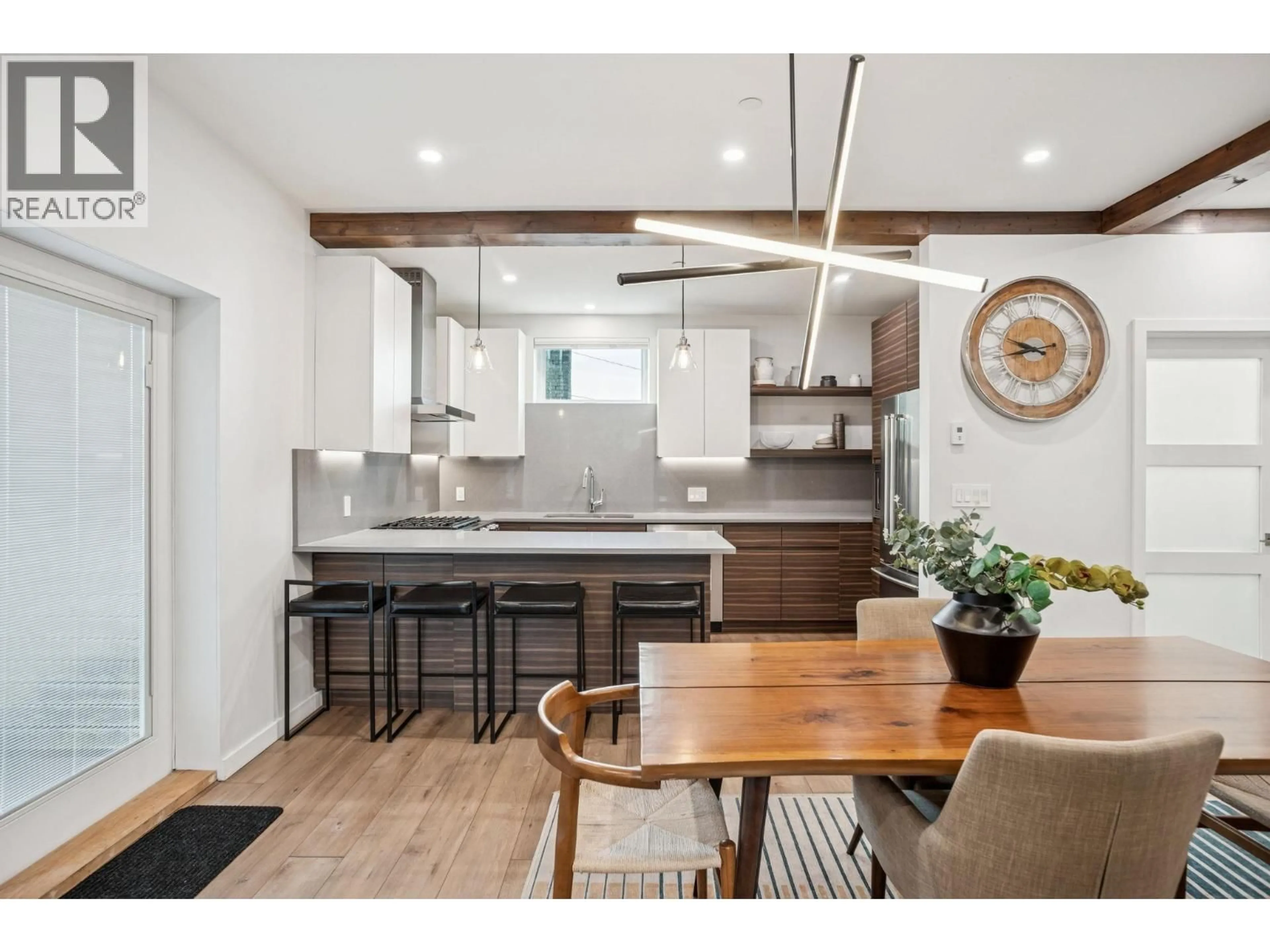 Open concept kitchen, wood/laminate floor for 933 MCLEAN DRIVE, Vancouver British Columbia V5L3N1