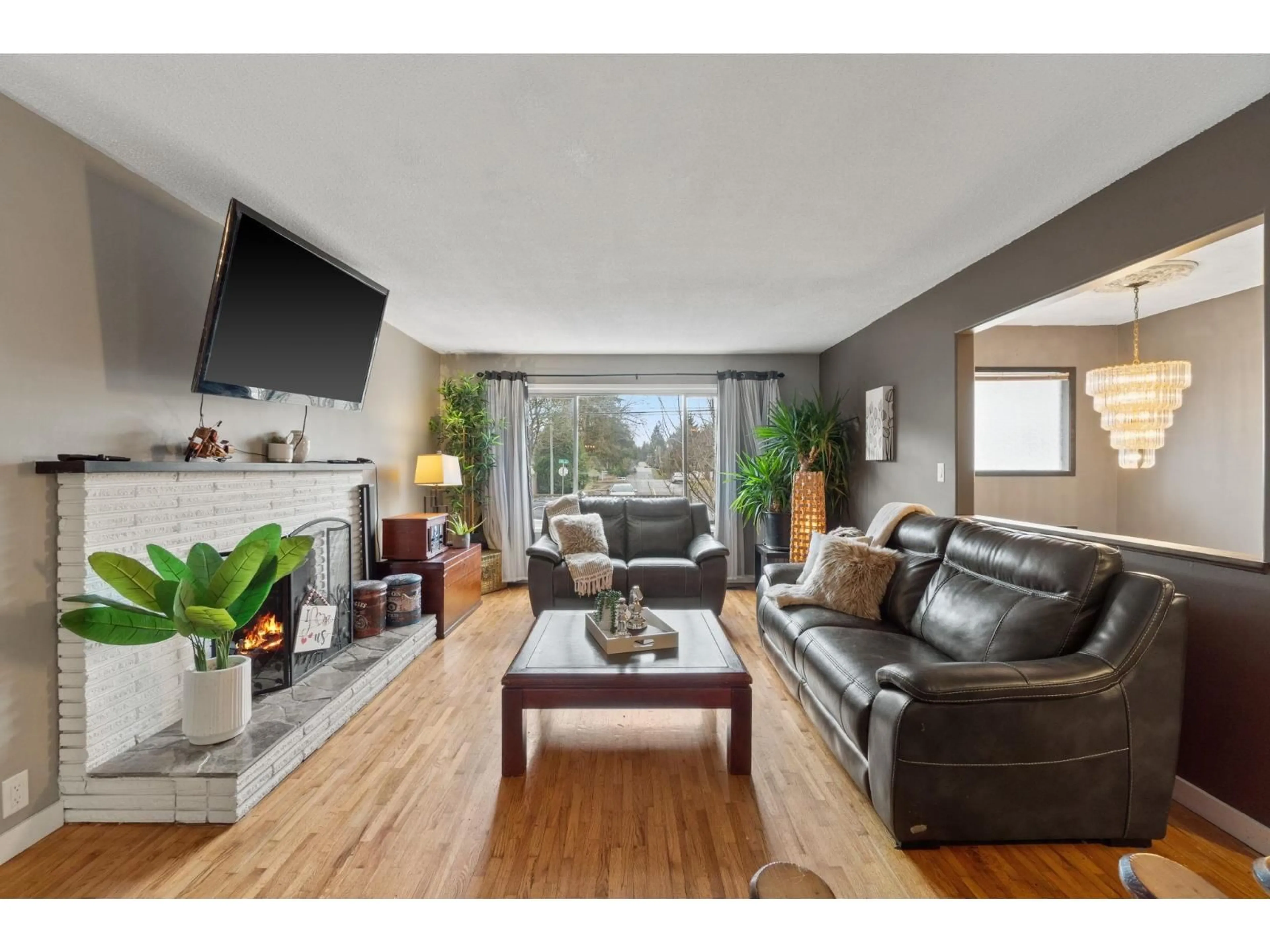 Living room with furniture, wood/laminate floor for 4900 200TH STREET, Langley British Columbia V3A1L5