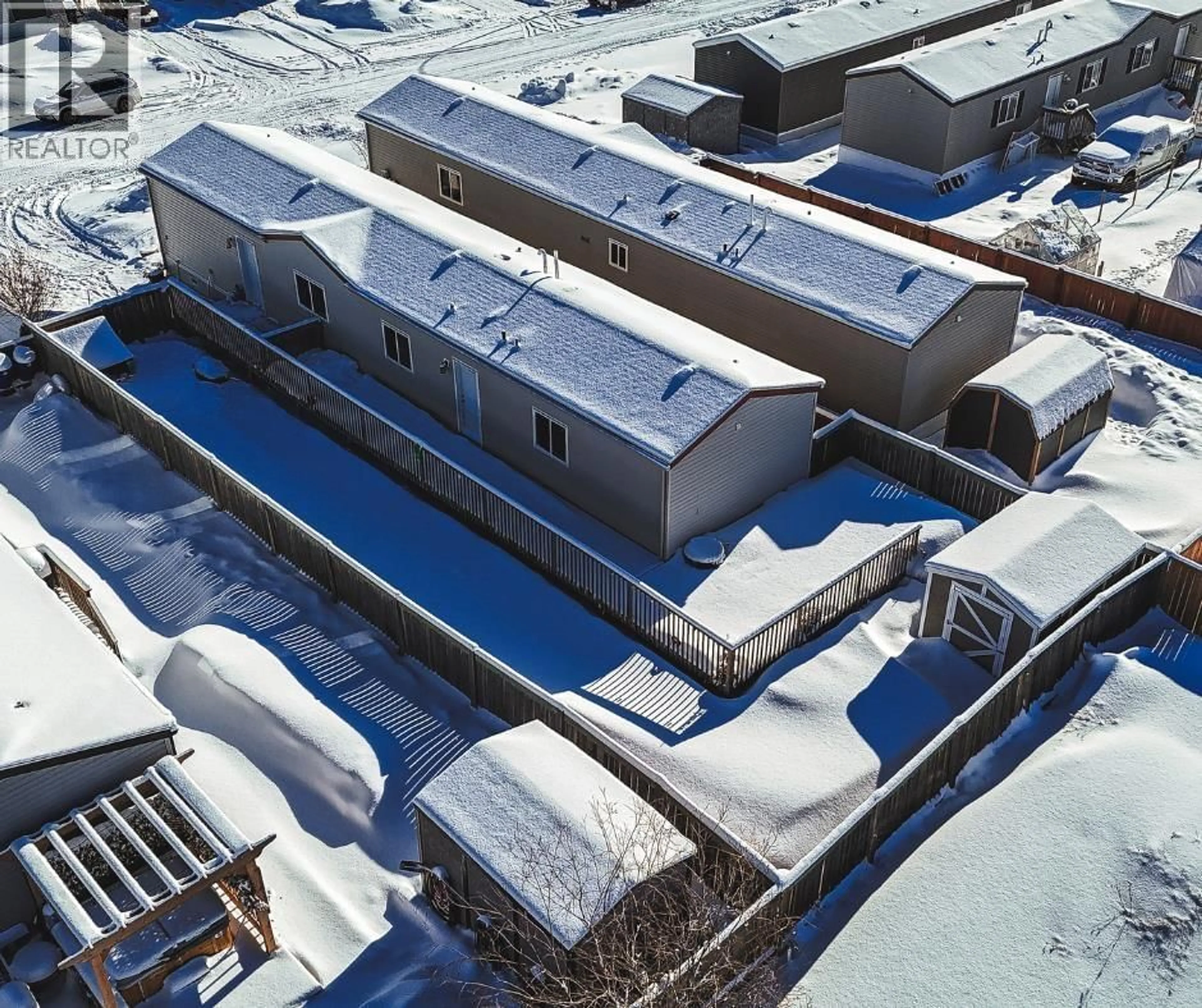 A pic from outside/outdoor area/front of a property/back of a property/a pic from drone, building for 8606 79A STREET, Fort St. John British Columbia V1J0H7