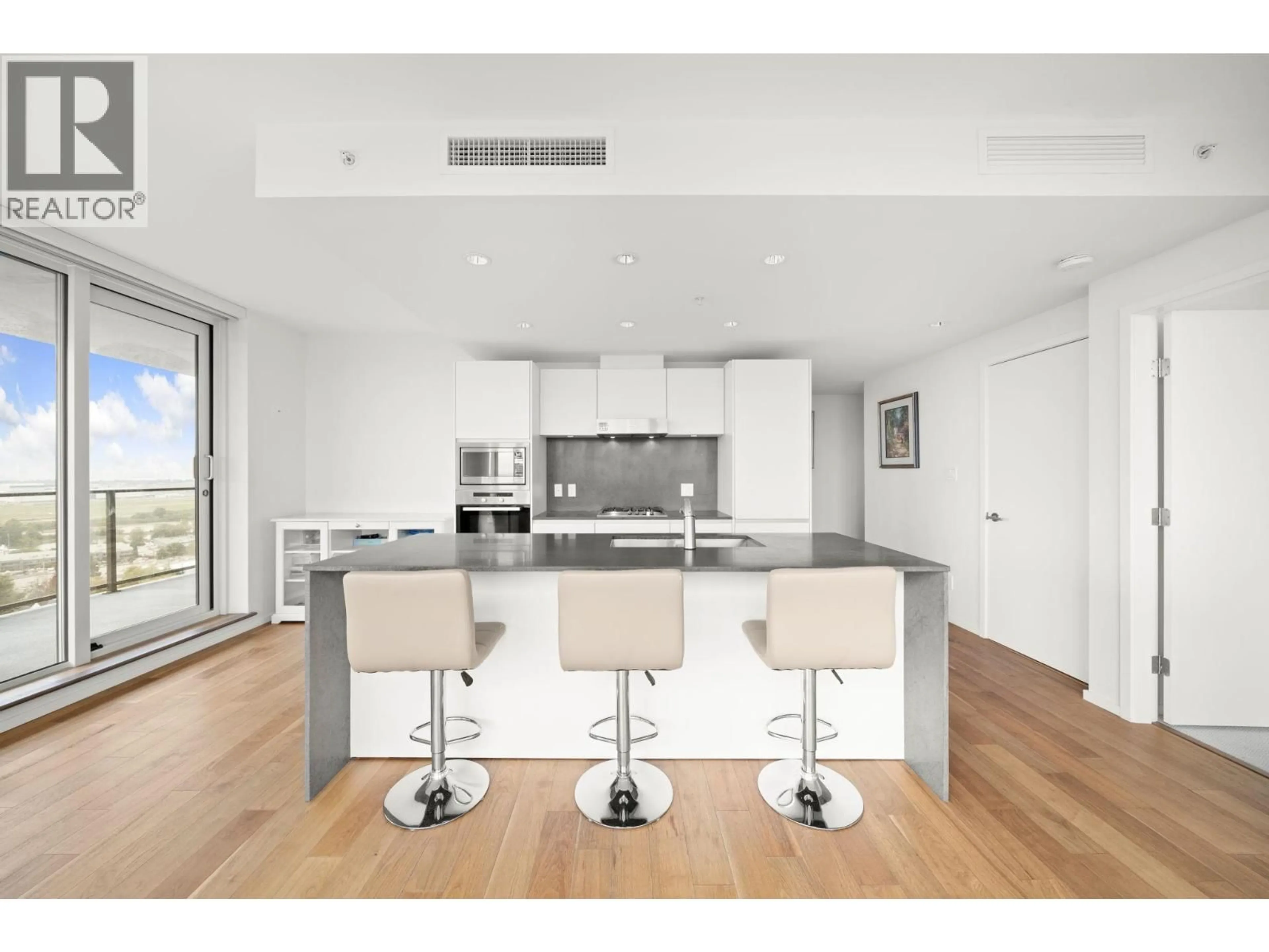 Open concept kitchen, wood/laminate floor for 1808 - 8555 GRANVILLE STREET, Vancouver British Columbia V6P0C3