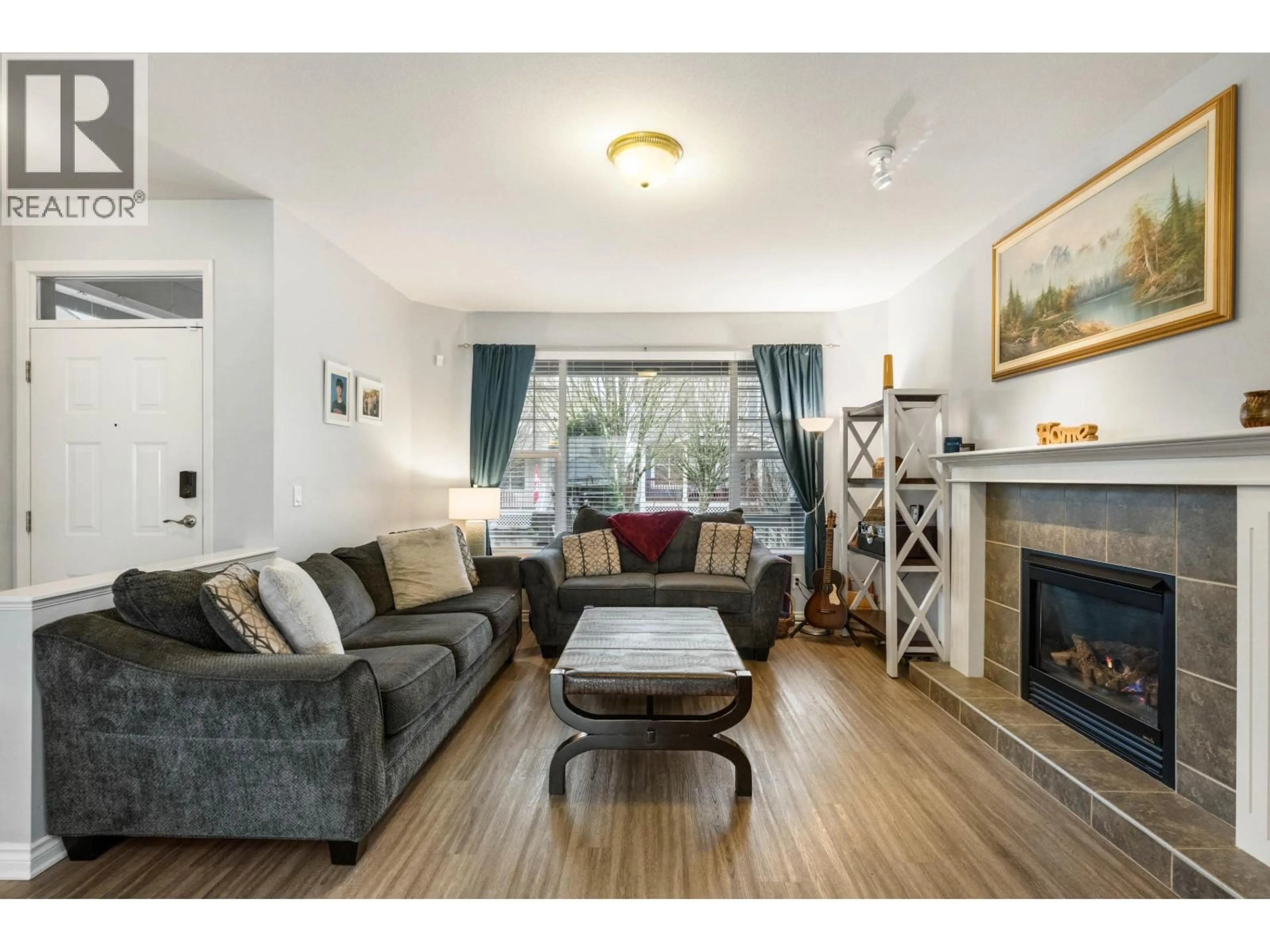Living room with furniture, wood/laminate floor for 24320 102A AVENUE, Maple Ridge British Columbia V2W1X9