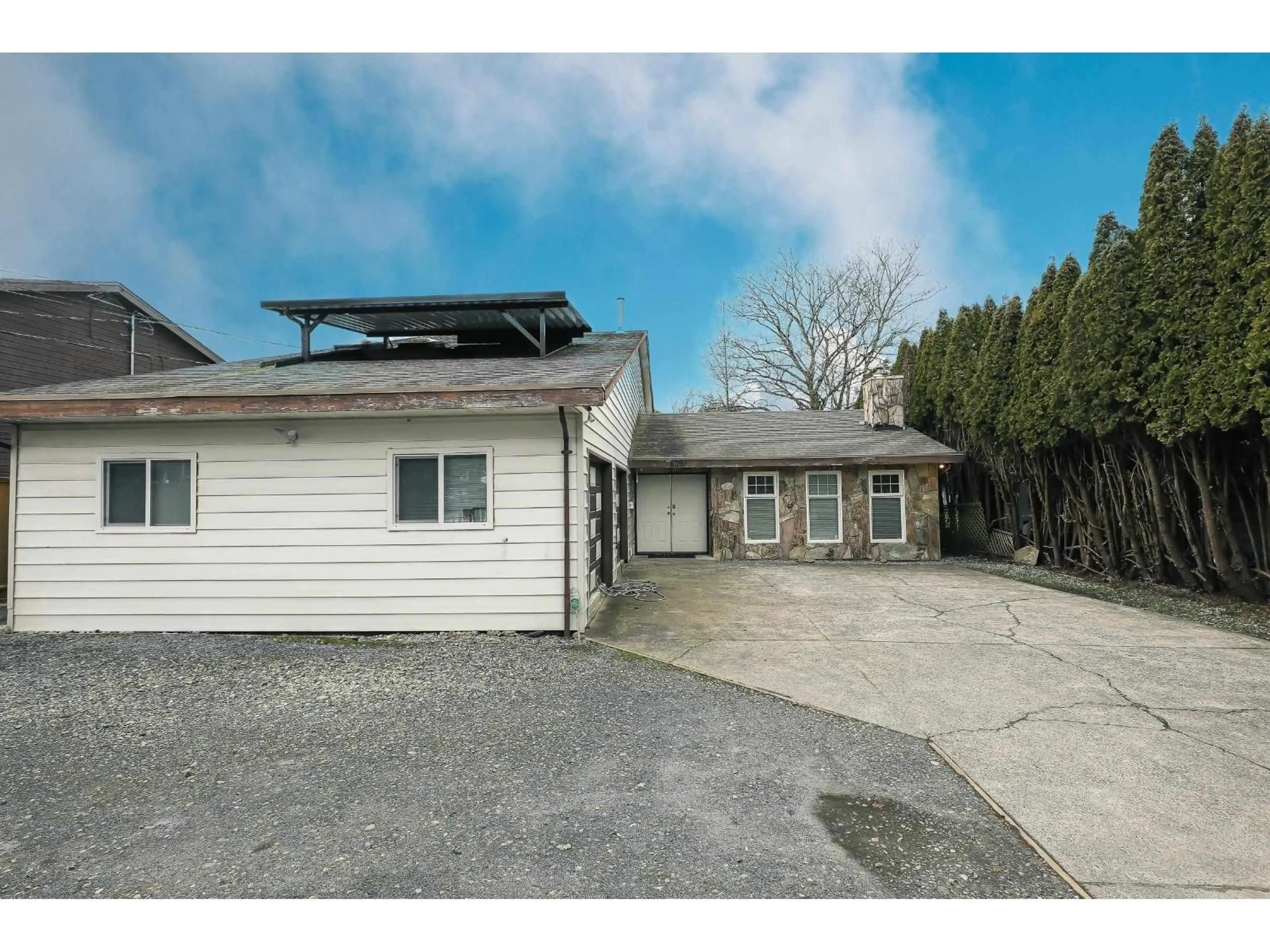 A pic from outside/outdoor area/front of a property/back of a property/a pic from drone, street for 6091 172 STREET, Surrey British Columbia V3S4Y2