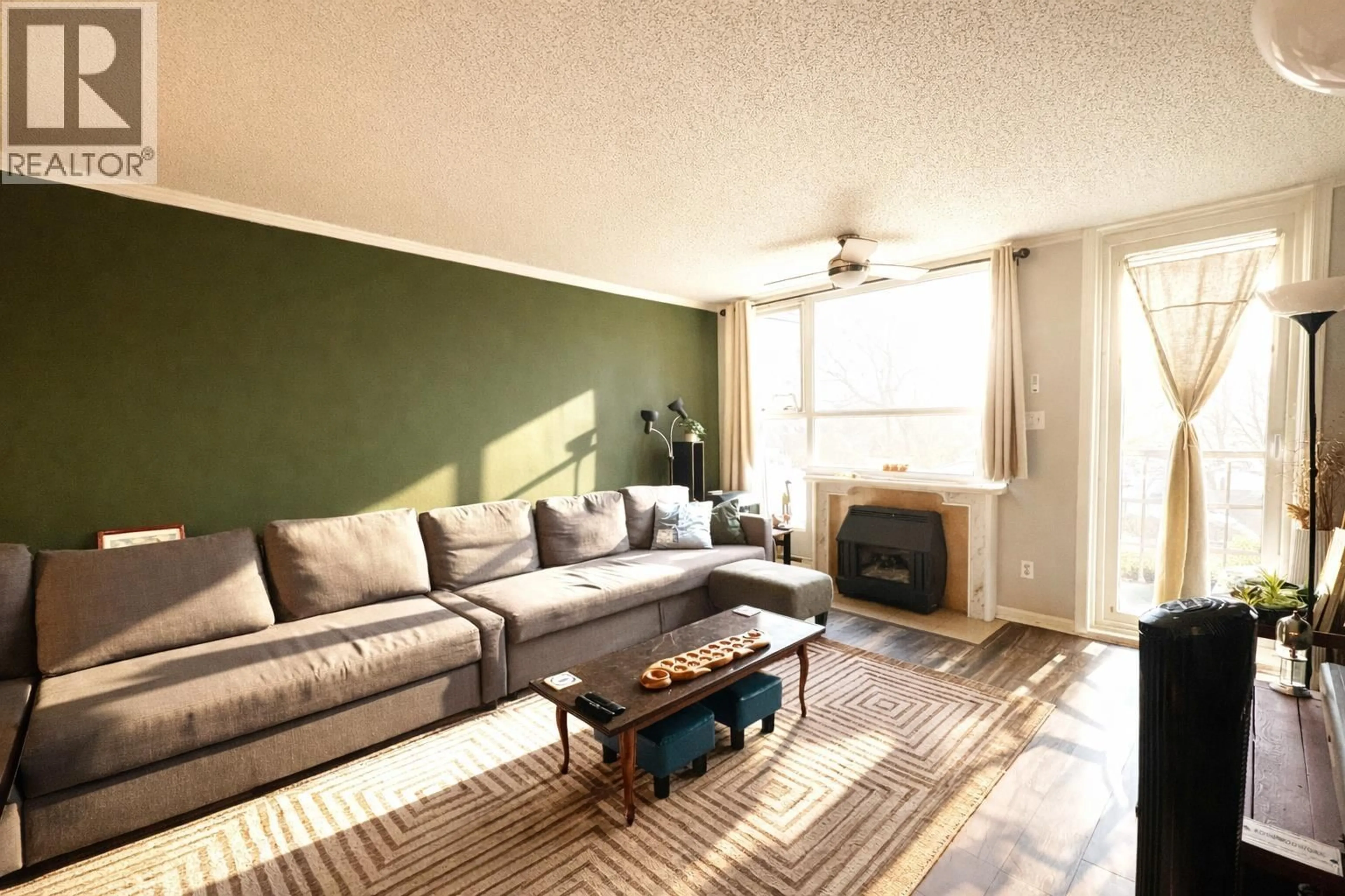 Living room with furniture, wood/laminate floor for 305 - 1250 QUAYSIDE DRIVE, New Westminster British Columbia V3M6E2