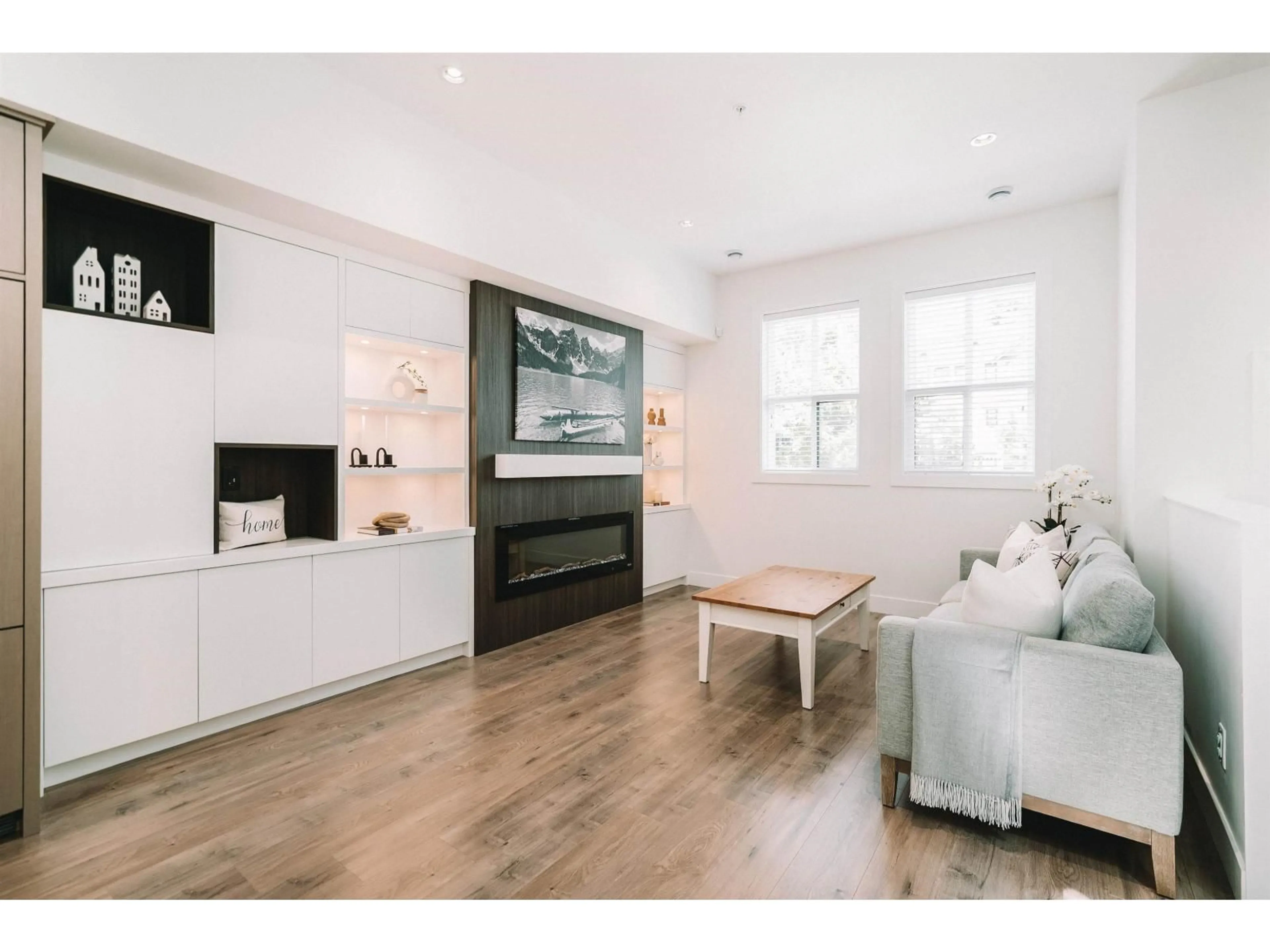 Living room with furniture, wood/laminate floor for 8133 202 STREET, Langley British Columbia V2Y3K2