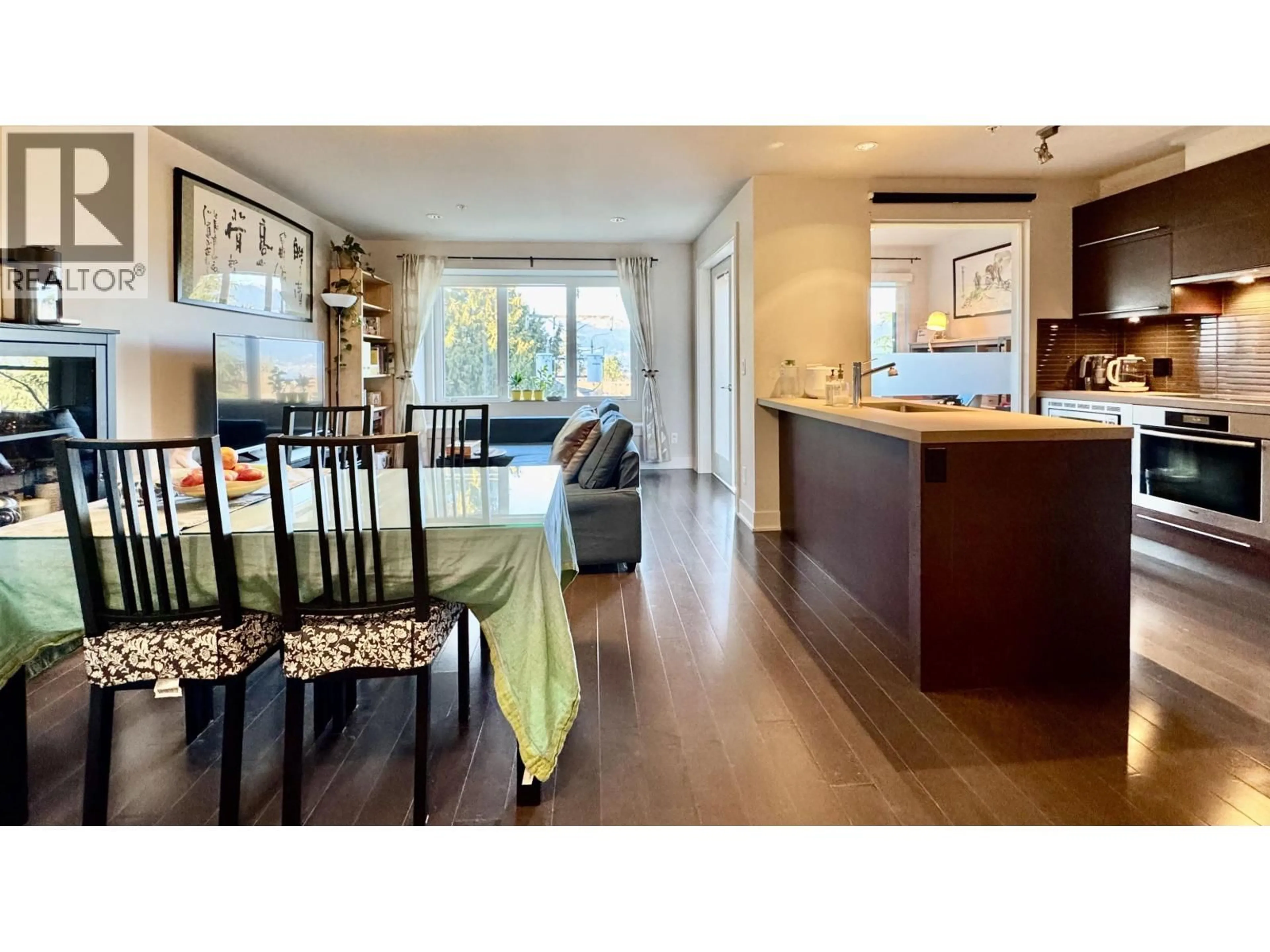 Open concept kitchen, wood/laminate floor for 305 - 4463 10TH AVENUE, Vancouver British Columbia V6R2H8