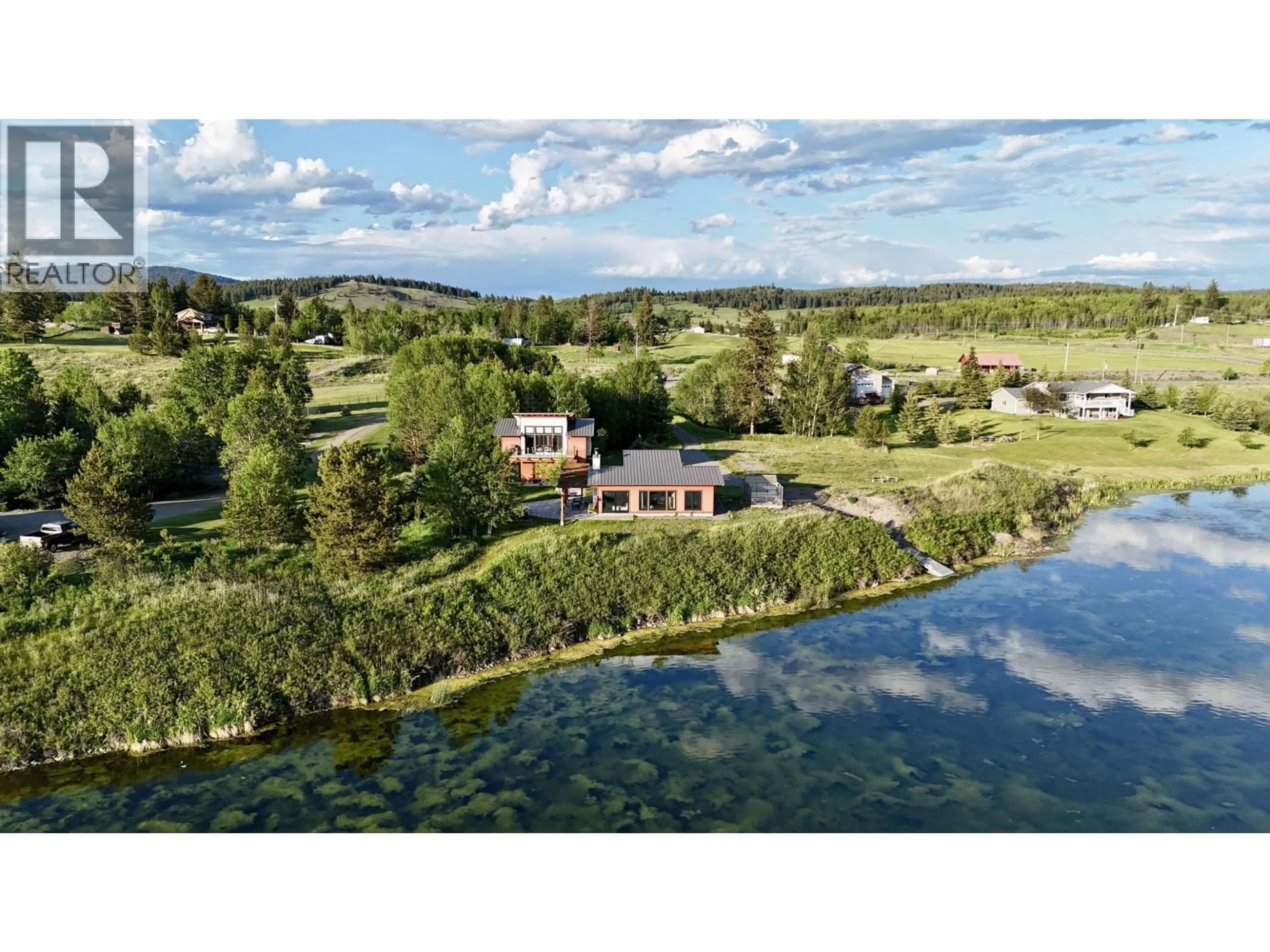 A pic from outside/outdoor area/front of a property/back of a property/a pic from drone, water/lake/river/ocean view for 5460 CARLSON ROAD, 100 Mile House British Columbia V0K2E1