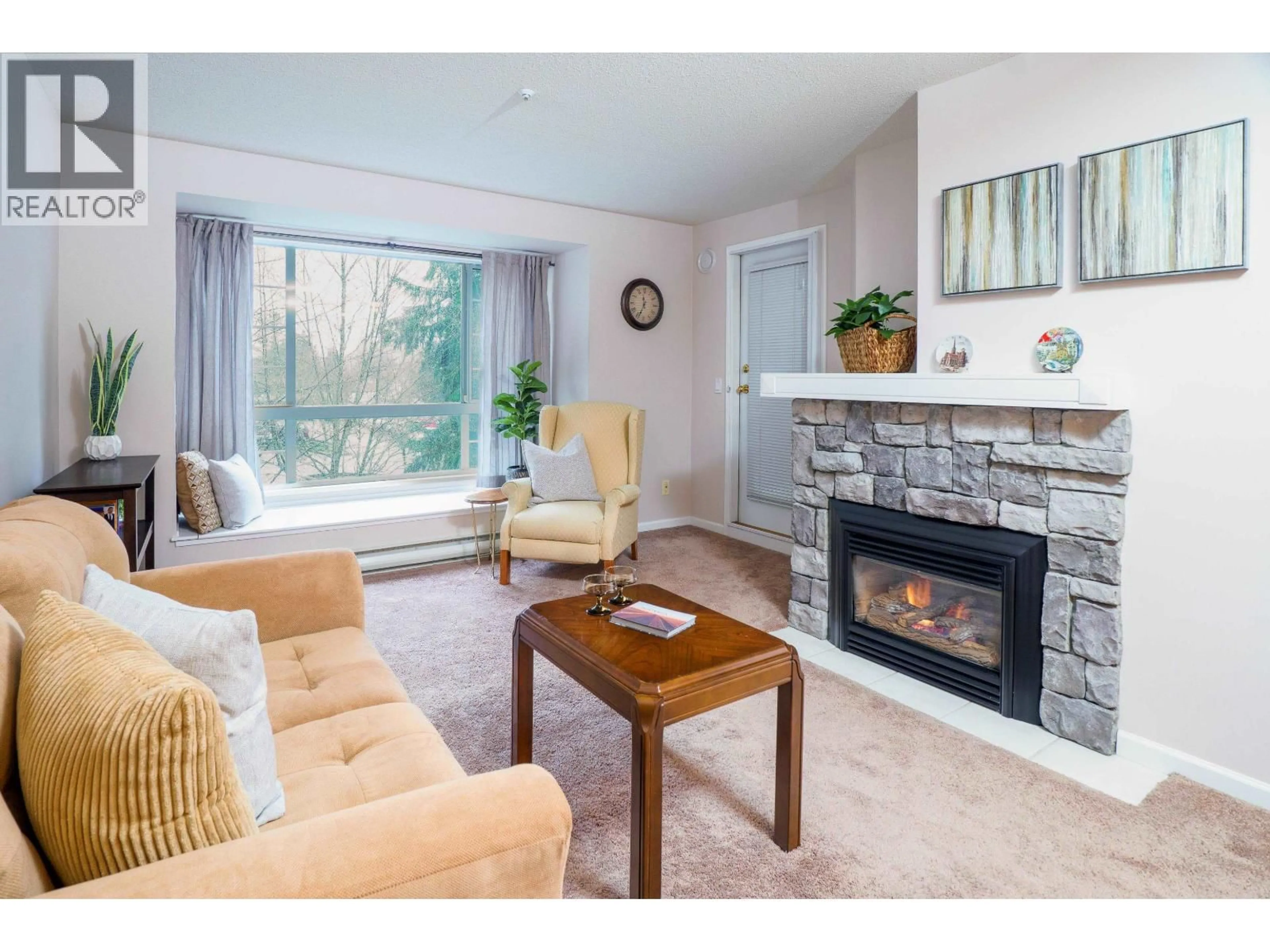 Living room with furniture, wood/laminate floor for 327 - 1252 TOWN CENTRE BOULEVARD, Coquitlam British Columbia V3B7R7