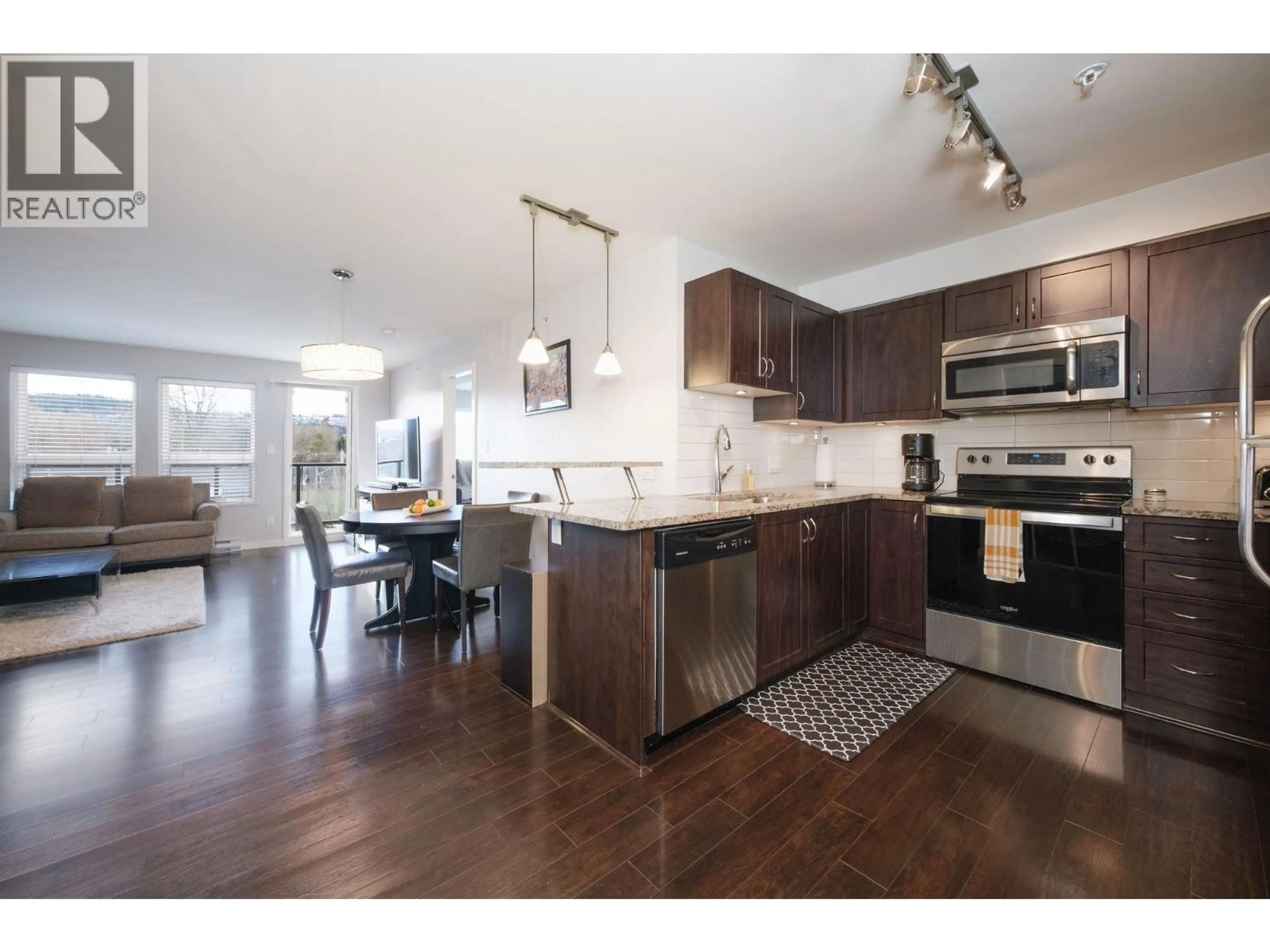 Open concept kitchen, wood/laminate floor for 306 - 2191 SHAUGHNESSY STREET, Port Coquitlam British Columbia V3C3C7