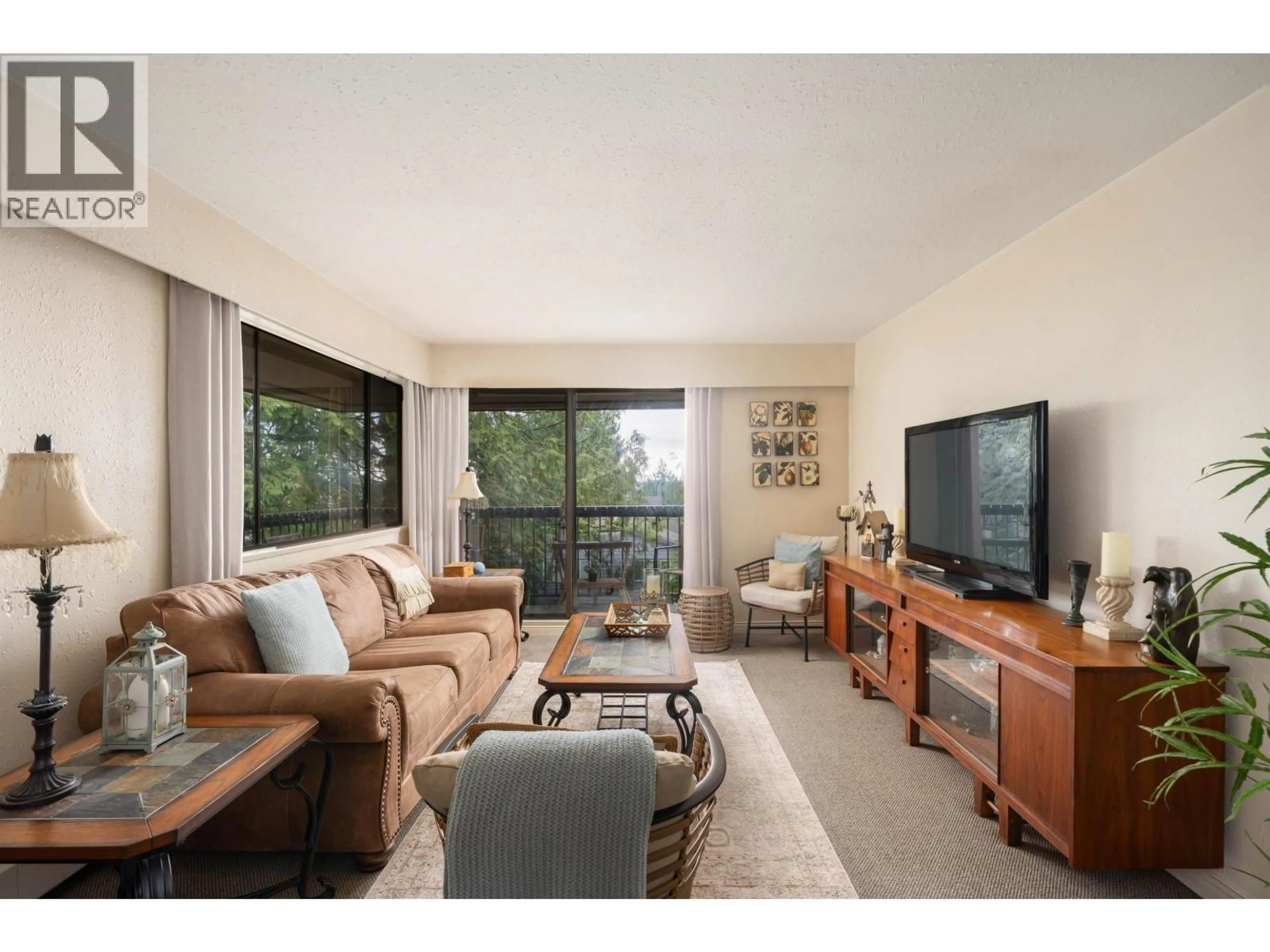 Living room with furniture, wood/laminate floor for 301 - 1000 KING ALBERT AVENUE, Coquitlam British Columbia V3J7A3