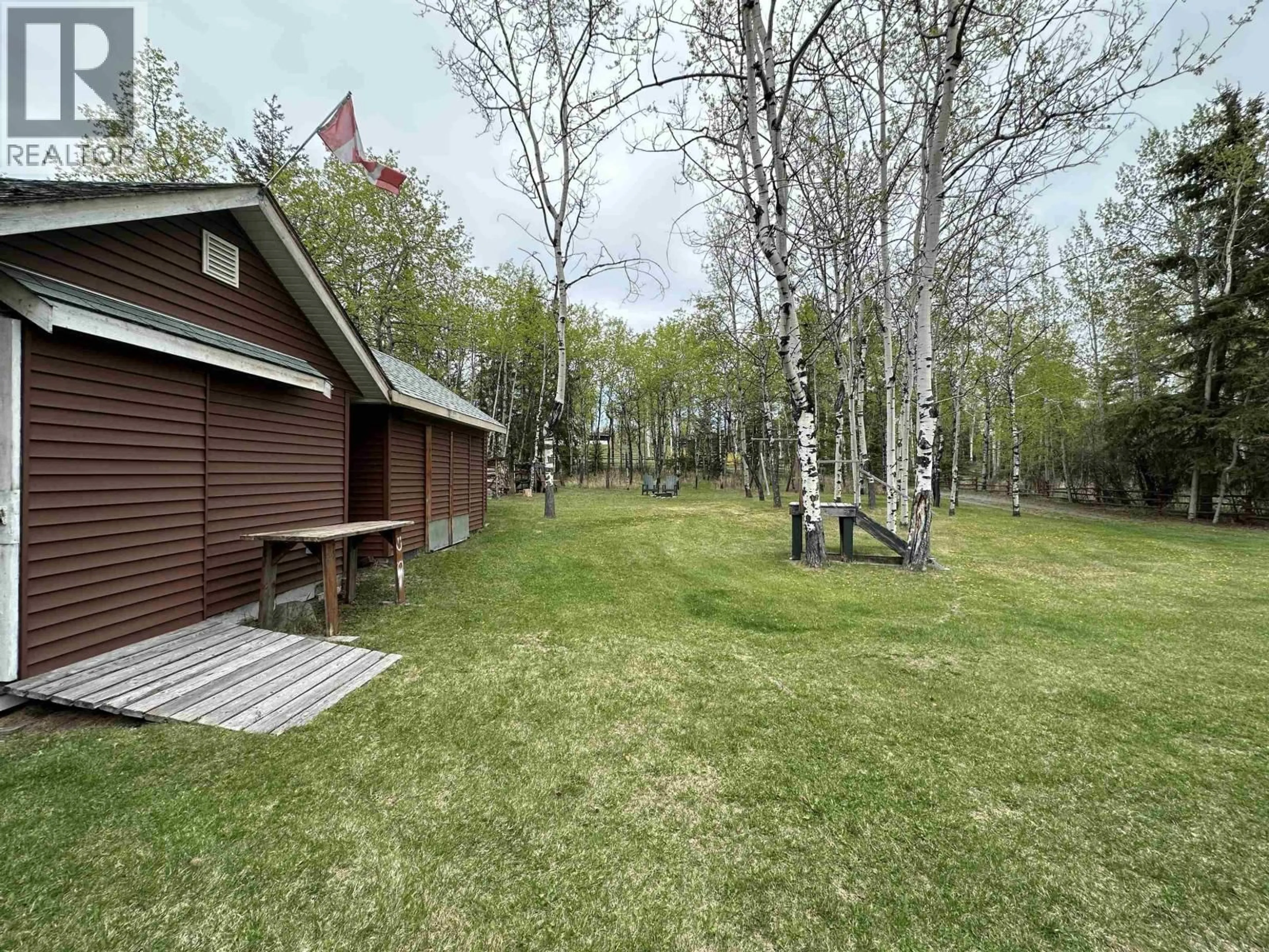 A pic from outside/outdoor area/front of a property/back of a property/a pic from drone, forest/trees view for 5738 GREEN LAKE ROAD, 70 Mile House British Columbia V0K2K1