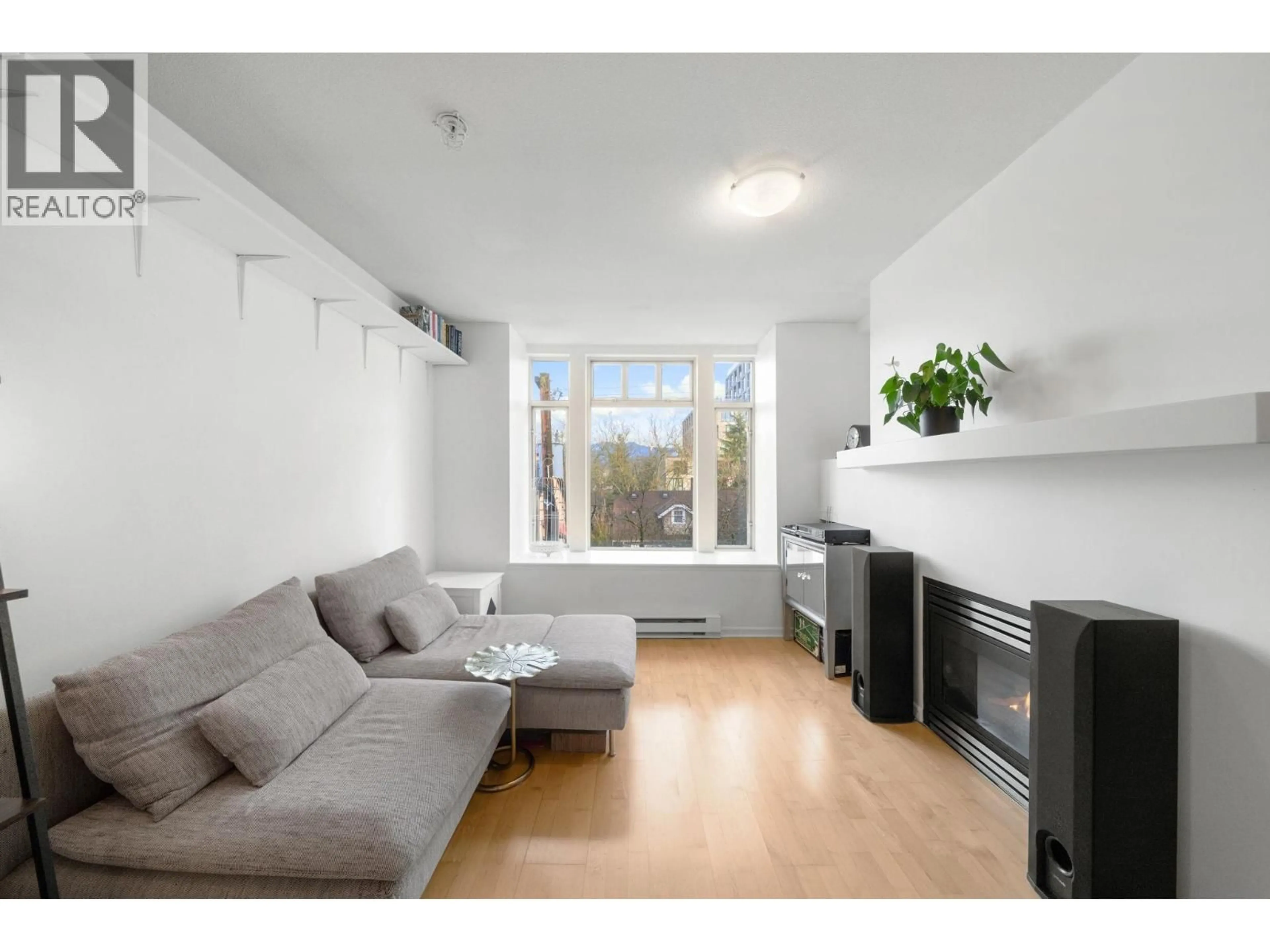 Living room with furniture, unknown for 301 - 3727 10 AVENUE, Vancouver British Columbia V6R2G5