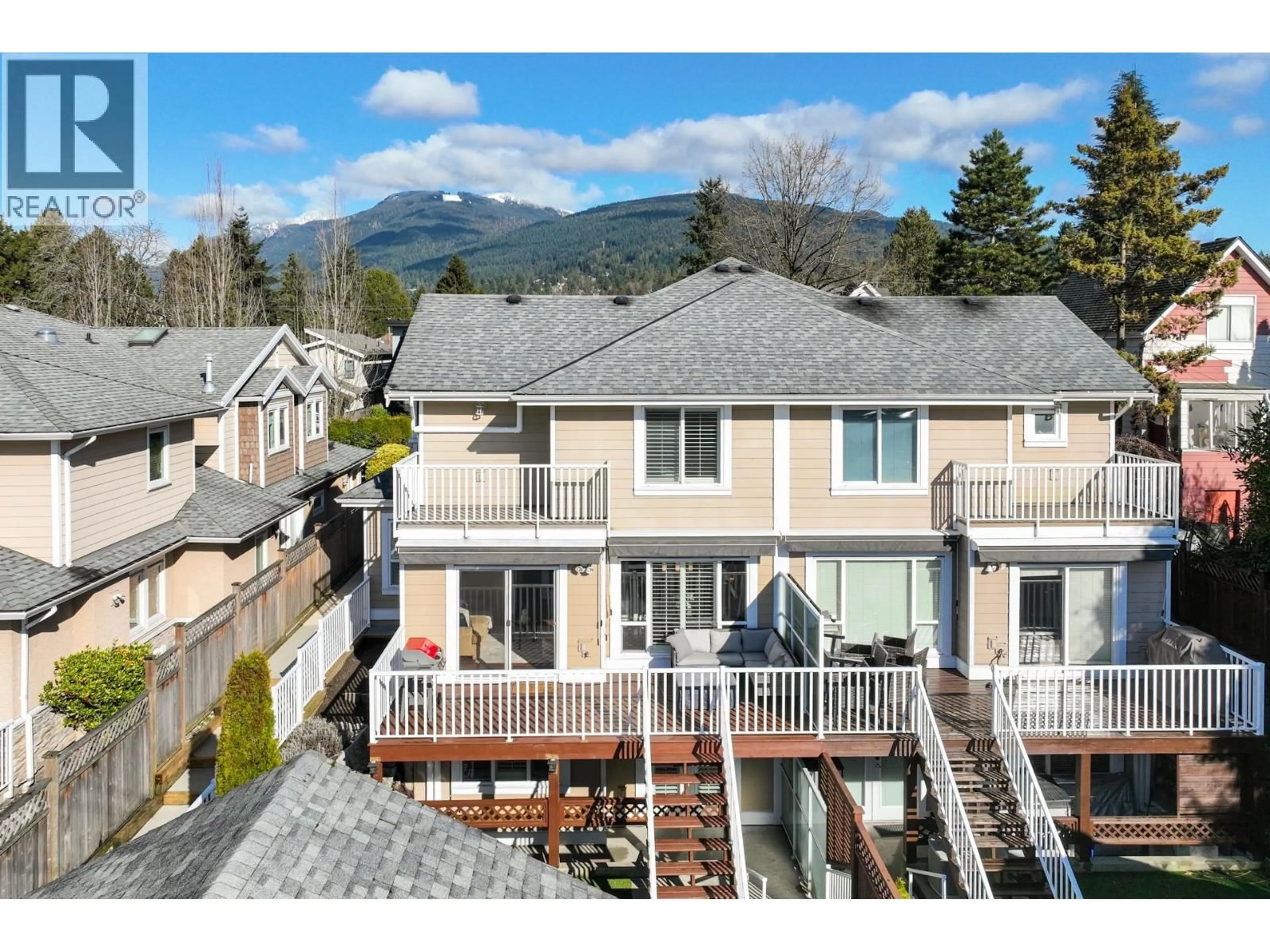 A pic from outside/outdoor area/front of a property/back of a property/a pic from drone, mountain view for 205 18TH STREET, North Vancouver British Columbia V7L2X7