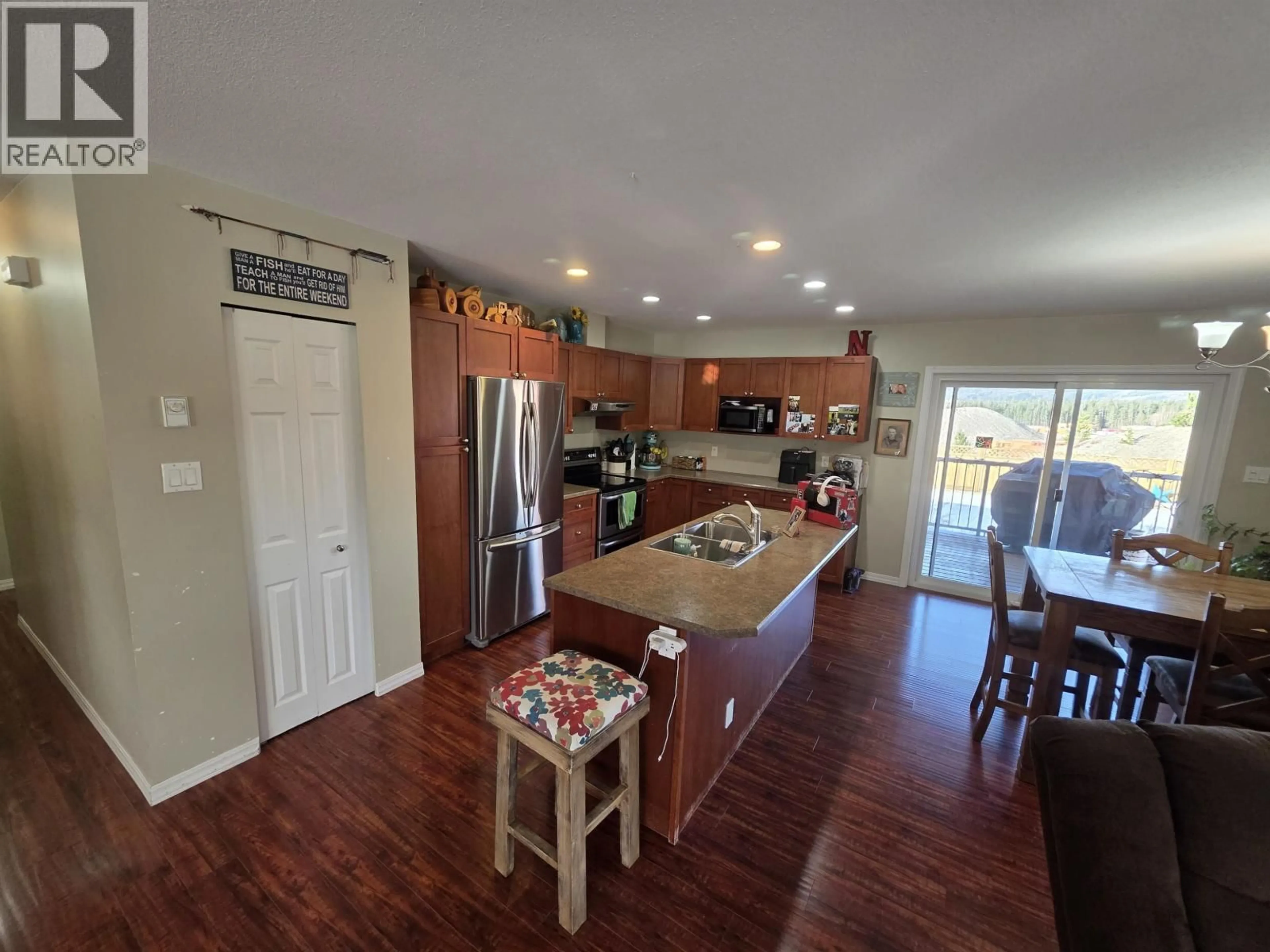 Open concept kitchen, wood/laminate floor for 3727 DOBBIE STREET, Terrace British Columbia V8G5T7