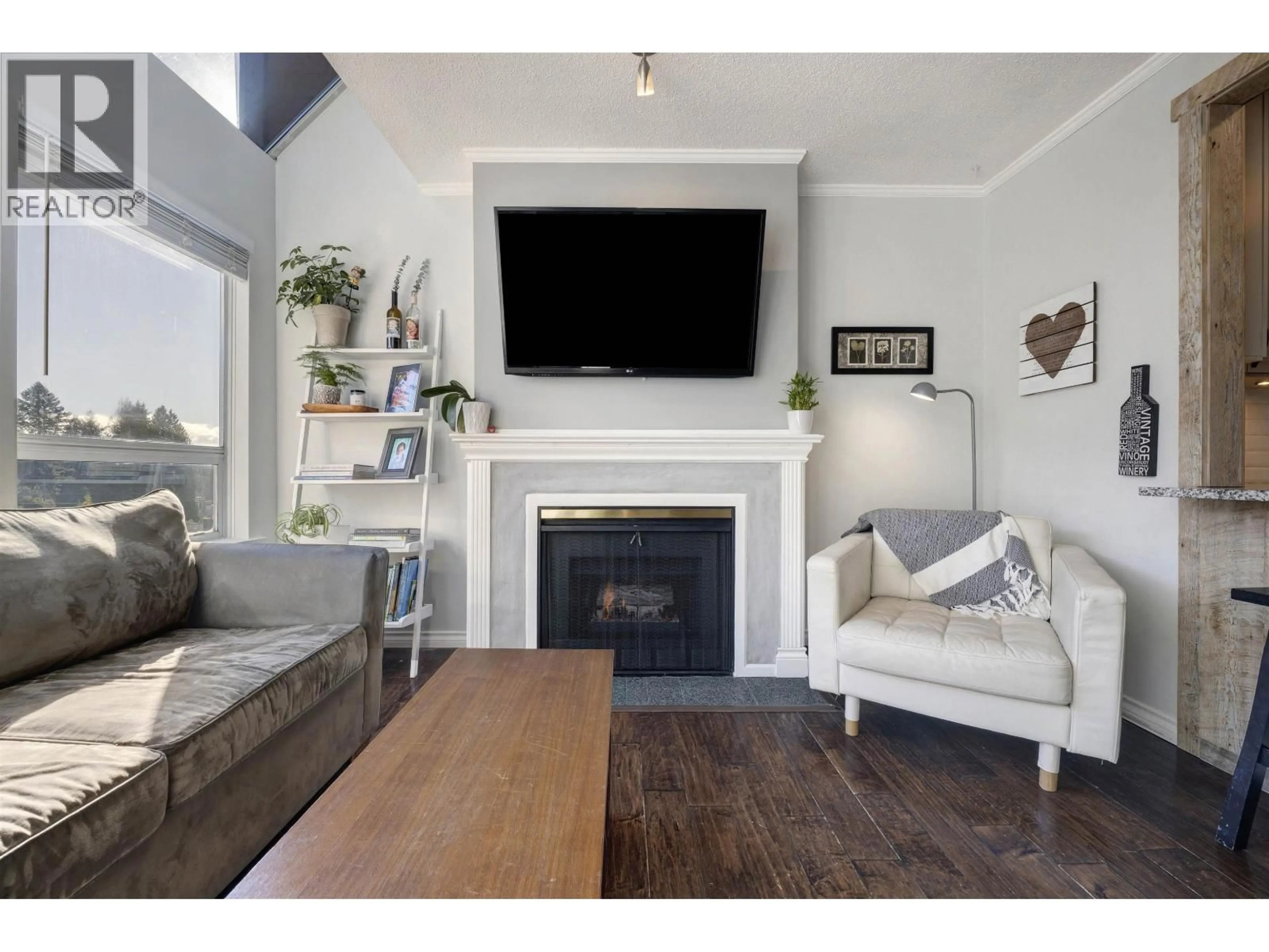 Living room with furniture, wood/laminate floor for 309 - 3721 DELBROOK AVENUE, North Vancouver British Columbia V7N3Z4