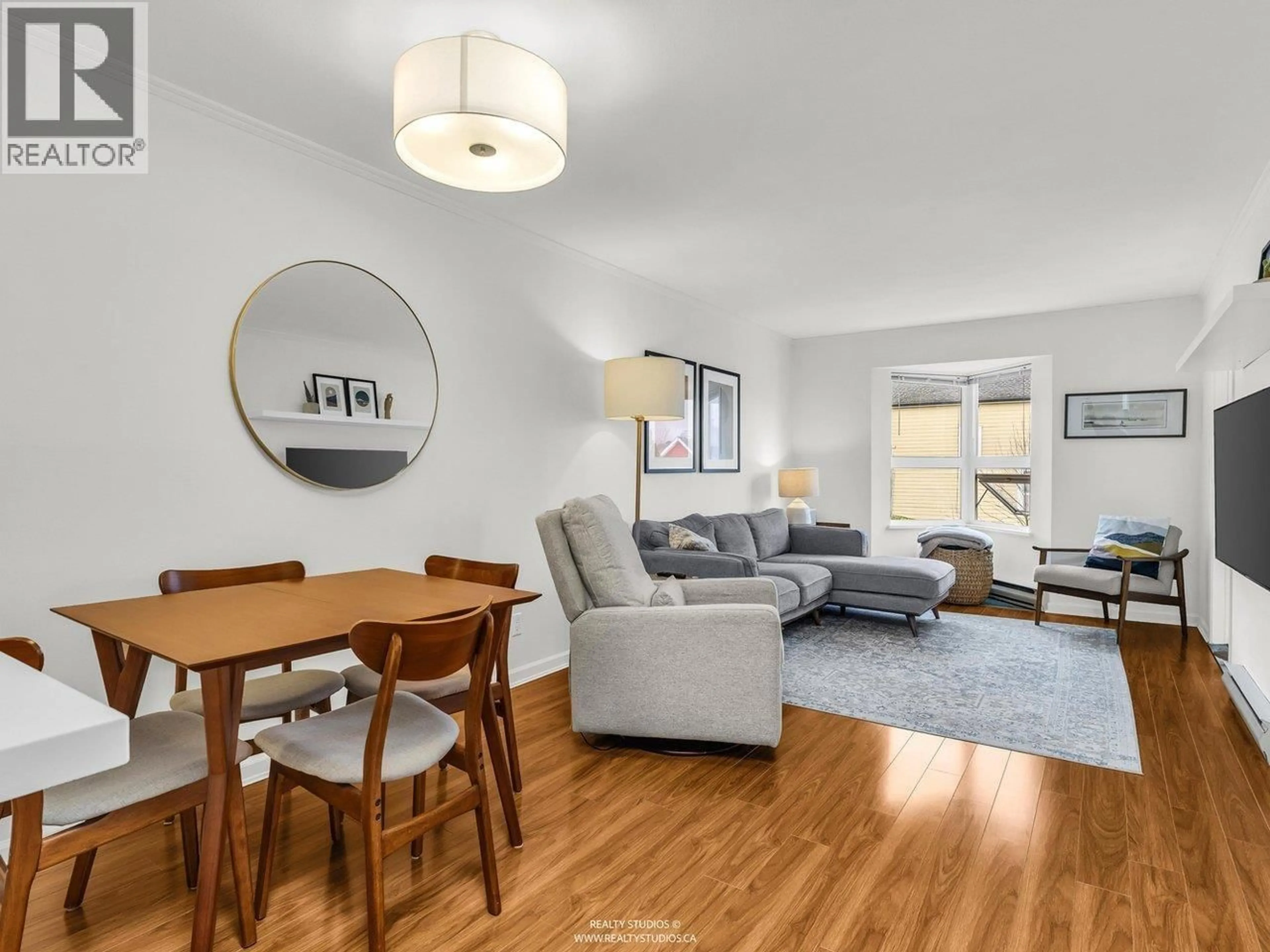 Living room with furniture, wood/laminate floor for 202 - 507 6TH AVENUE, Vancouver British Columbia V5T1K9