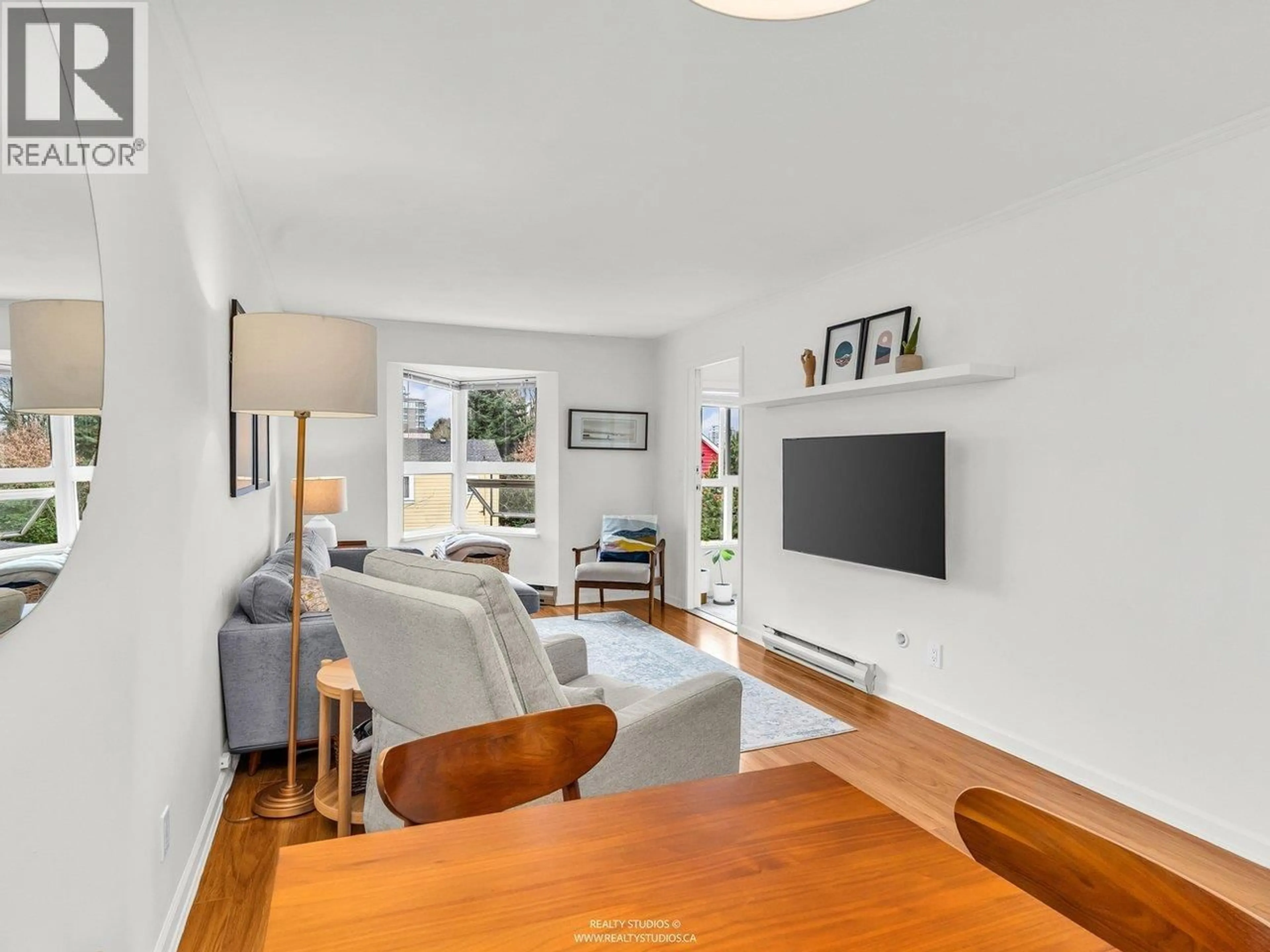 Living room with furniture, wood/laminate floor for 202 - 507 6TH AVENUE, Vancouver British Columbia V5T1K9