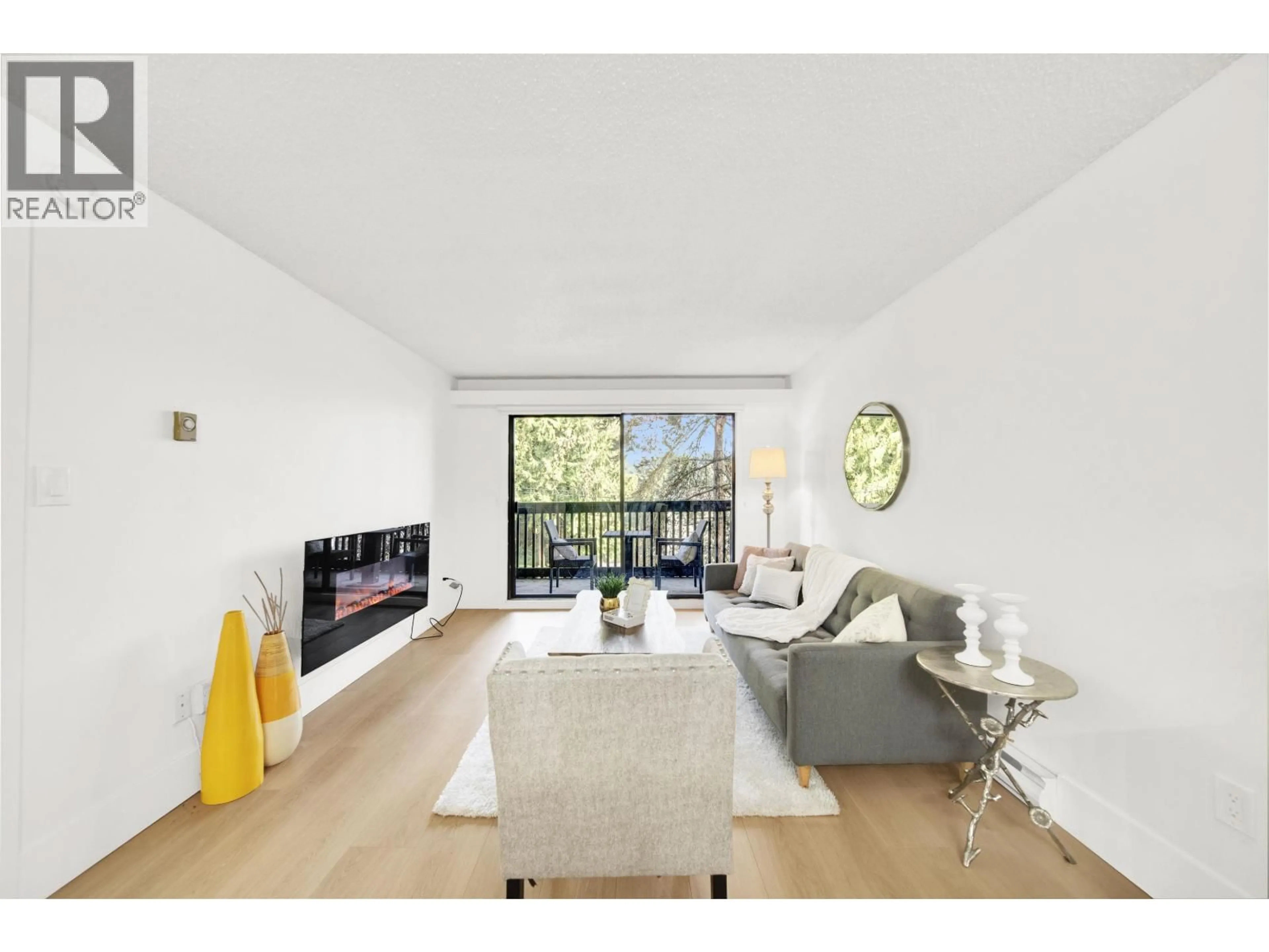 Living room with furniture, wood/laminate floor for 207 - 37 AGNES STREET, New Westminster British Columbia V3L5G9