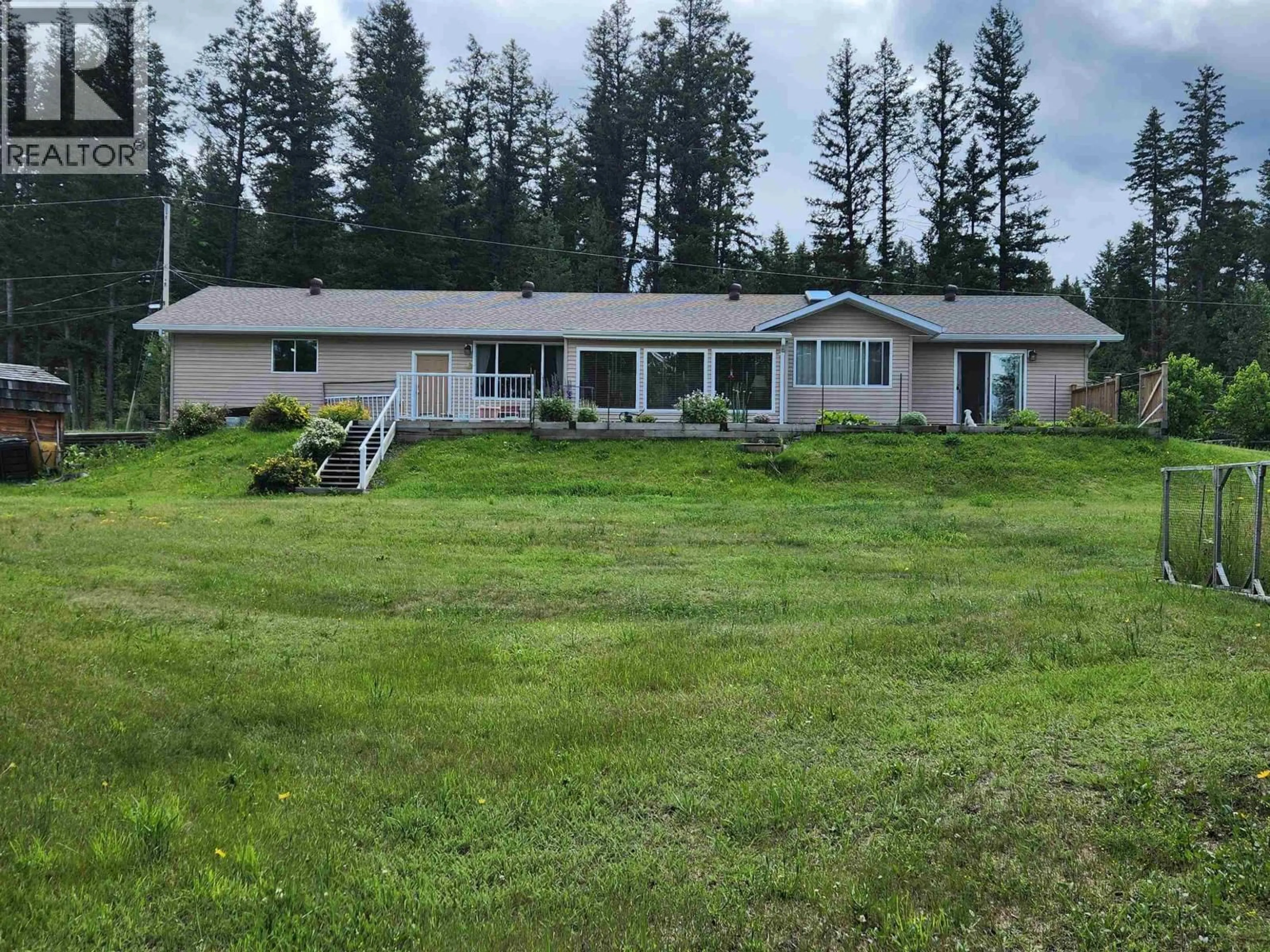 A pic from outside/outdoor area/front of a property/back of a property/a pic from drone, mountain view for 5207 KALLUM DRIVE, 108 Mile Ranch British Columbia V0K2Z0